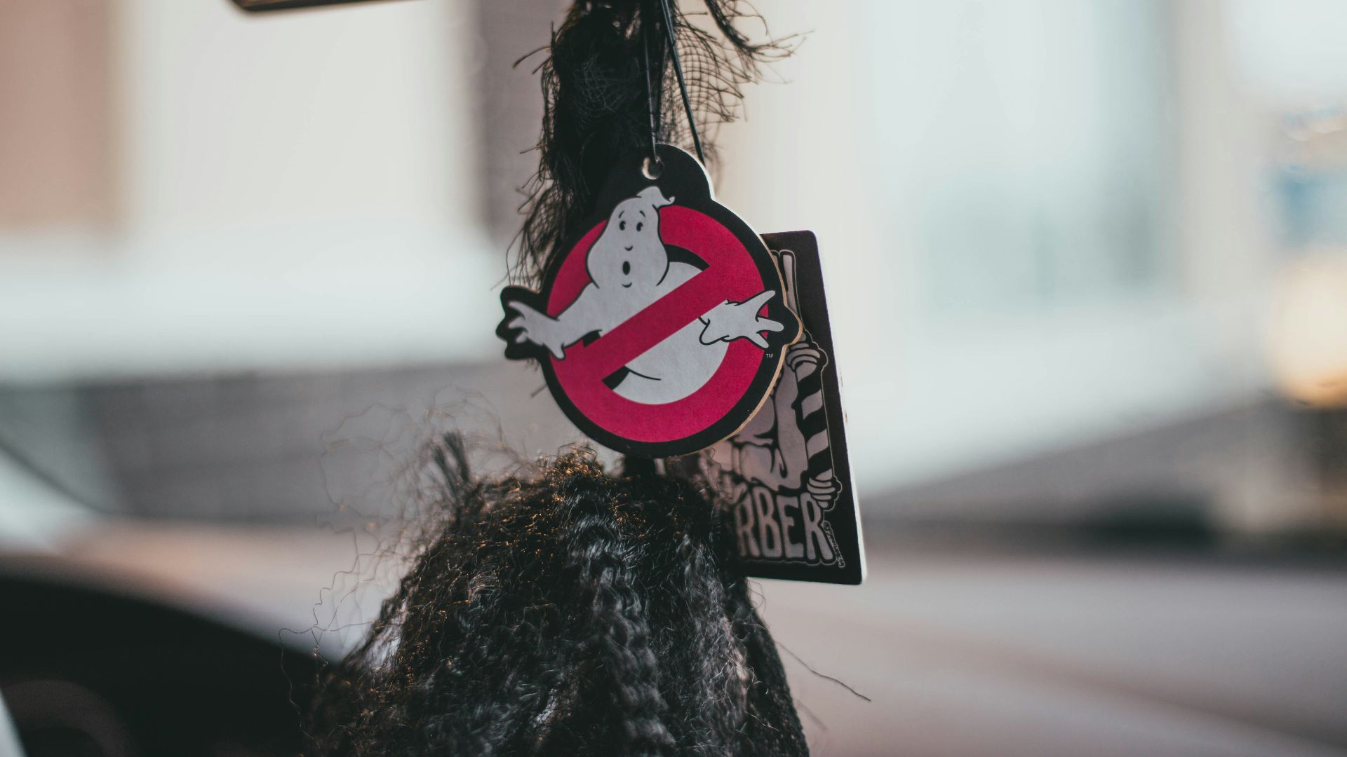 a close up of a car mirror with a sticker on it