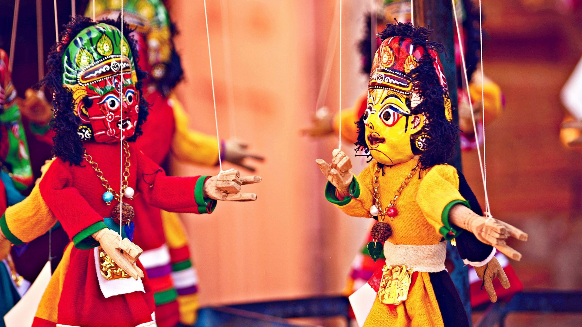 selective focus photography of deity marionettes