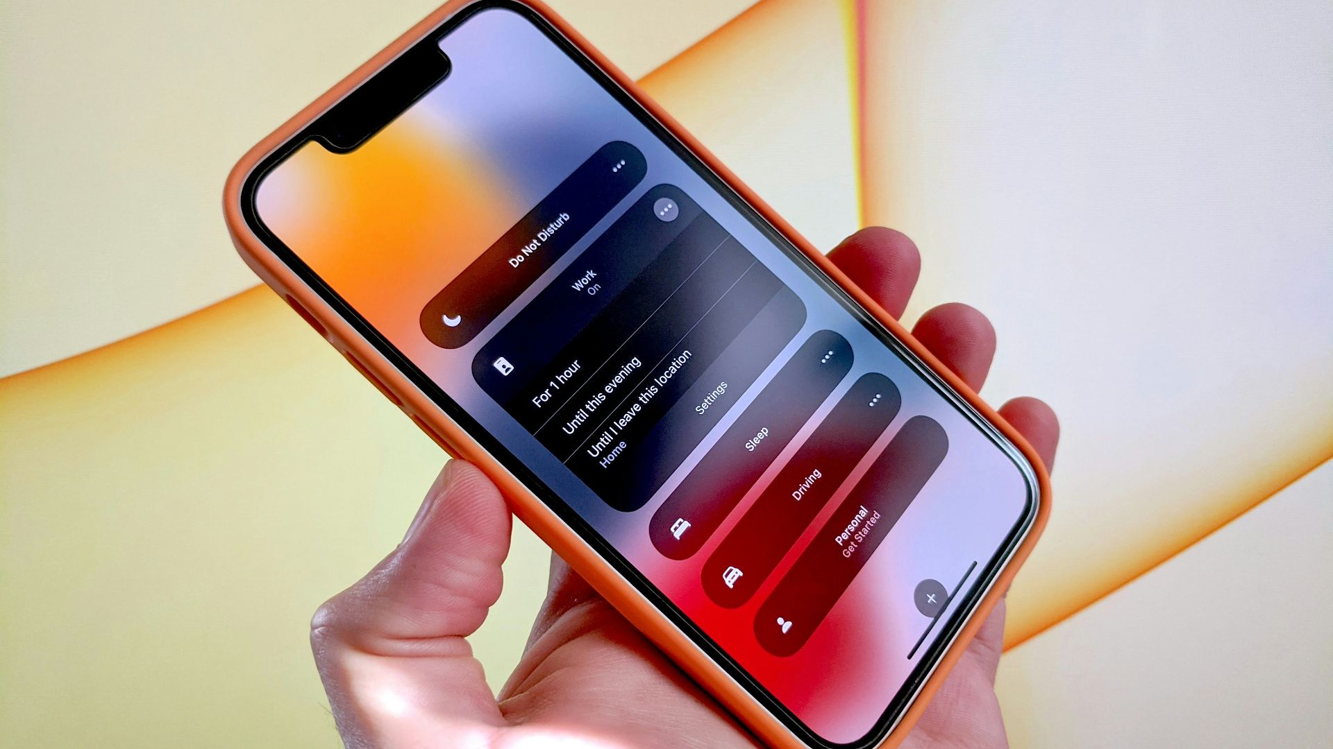 a person holding a cell phone in their hand