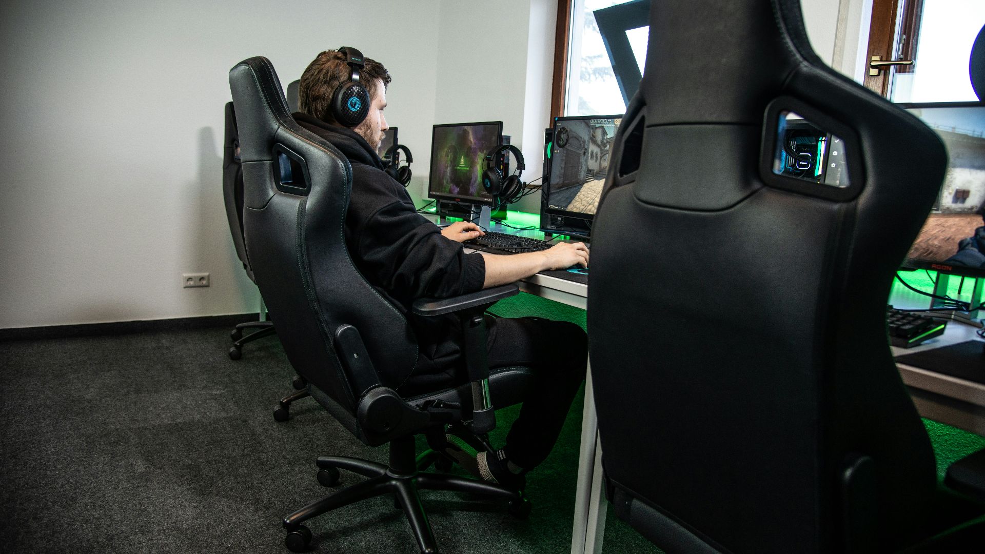 woman in black jacket sitting on black office rolling chair