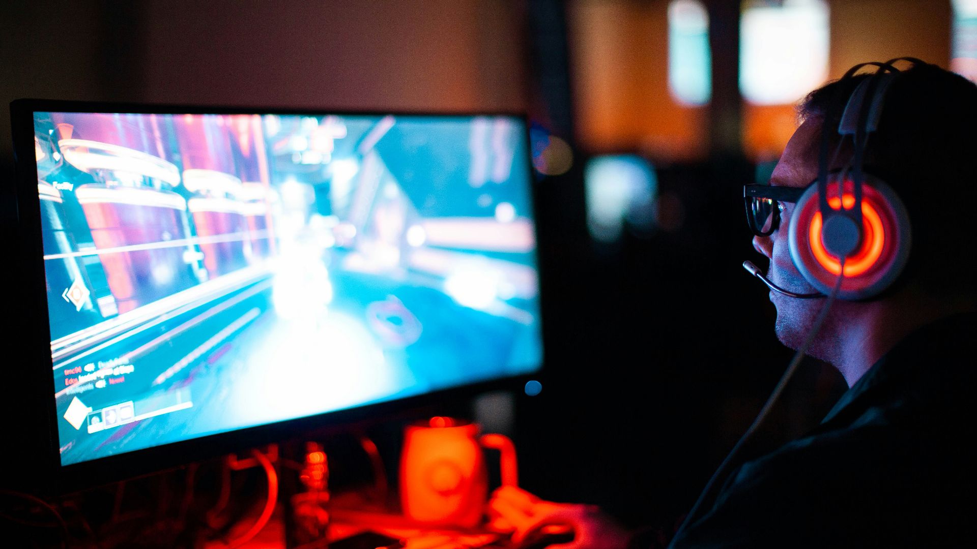 person using computer playing FPS game