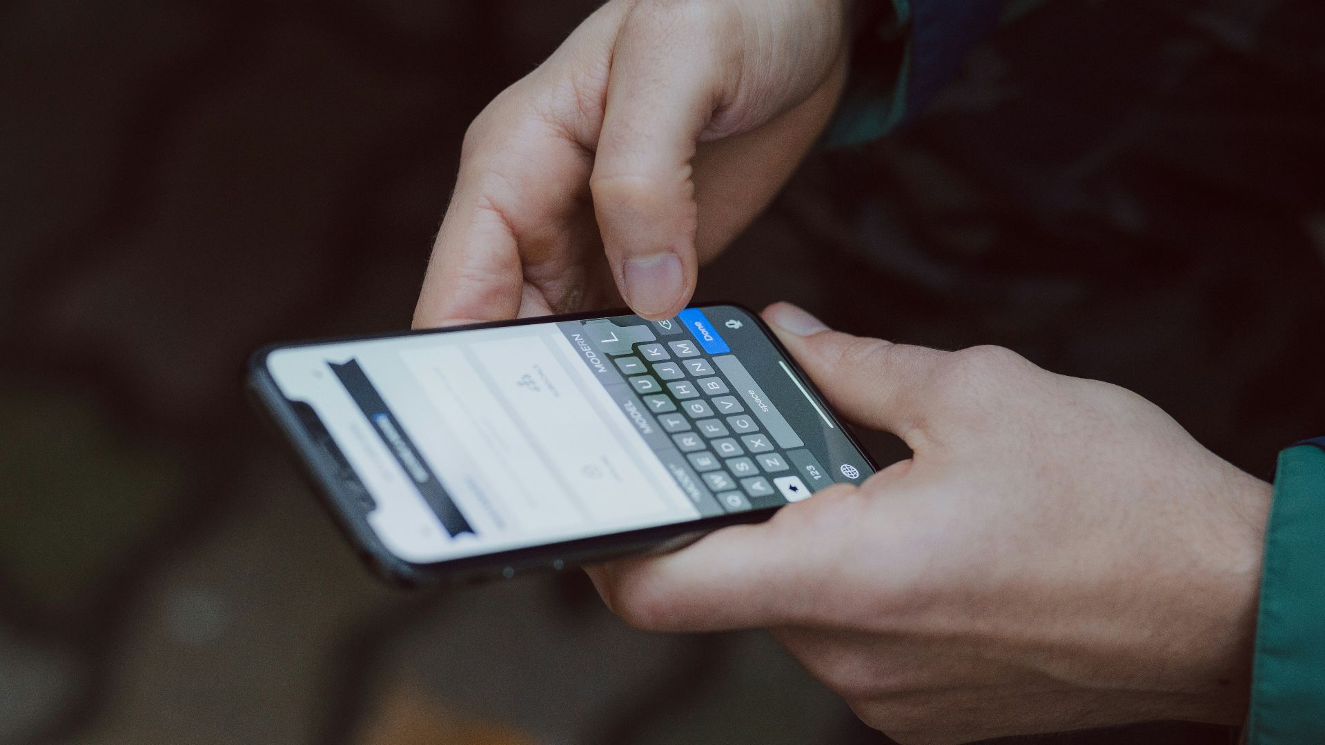 selective focus photography of person using smartphone