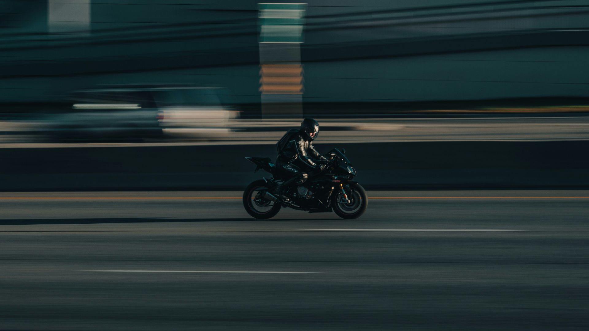 a person riding a motorcycle on a city street
