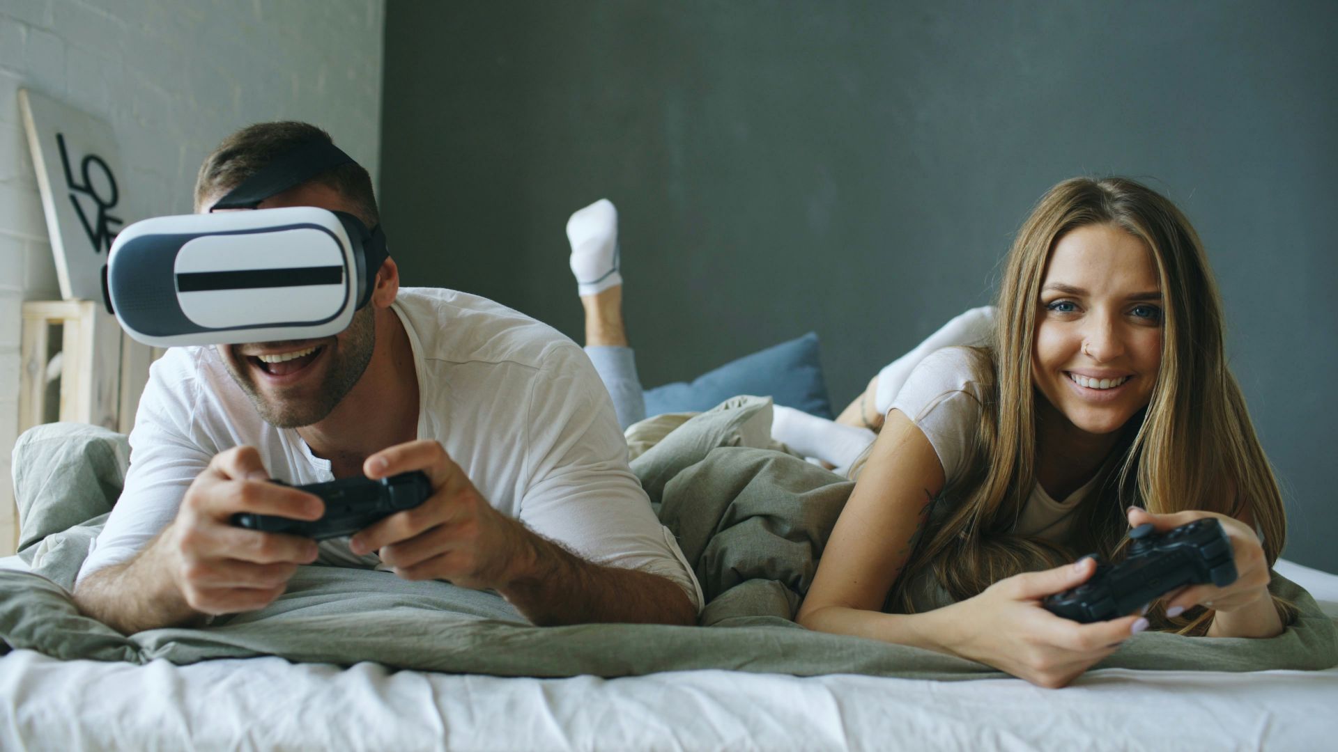 Couple playing video games with vr headset