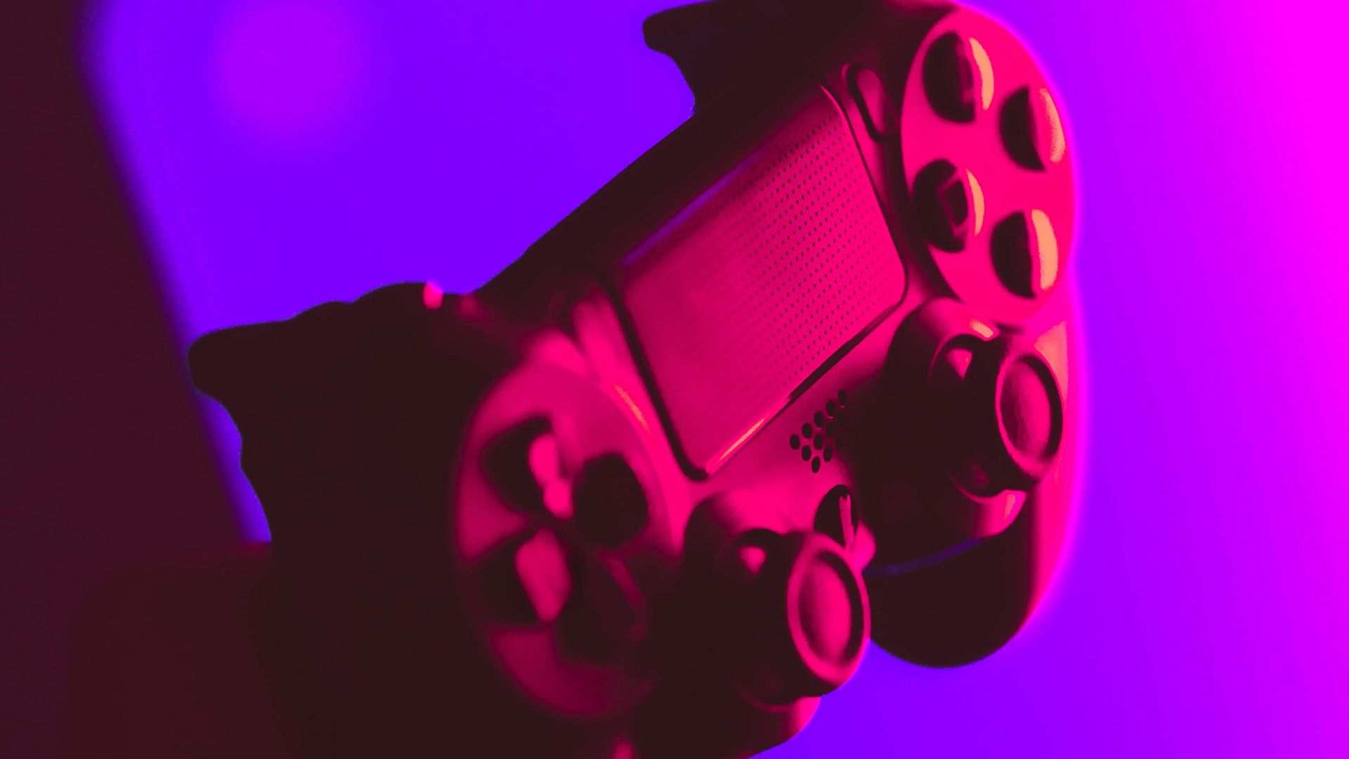 person holding black and gray game controller