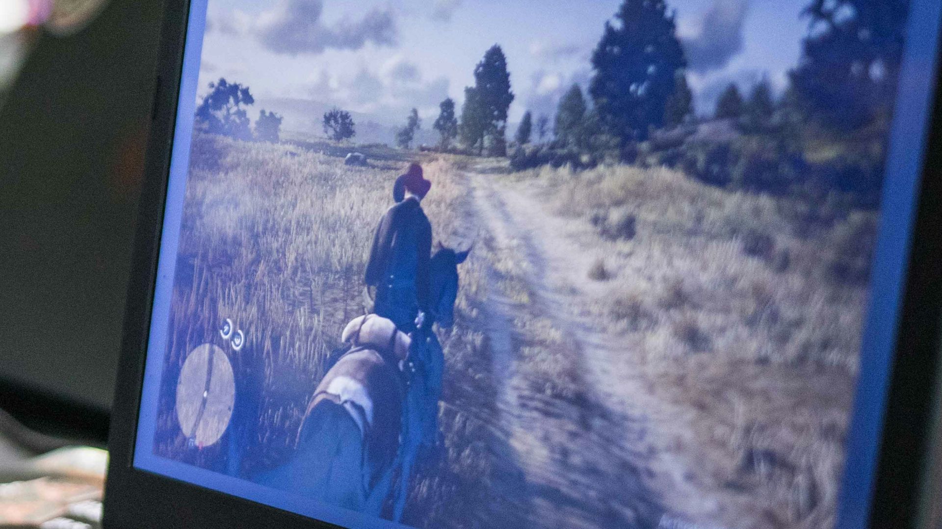 a couple of laptops sit on a table