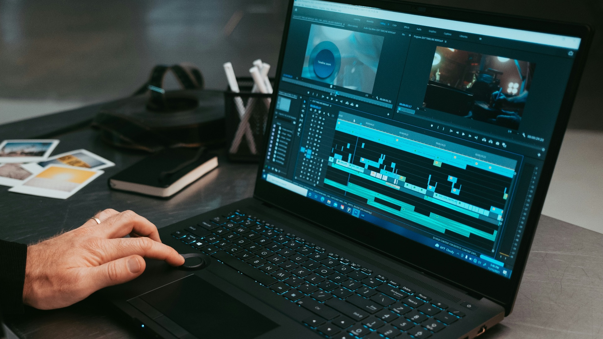 a man sitting at a table using a laptop computer