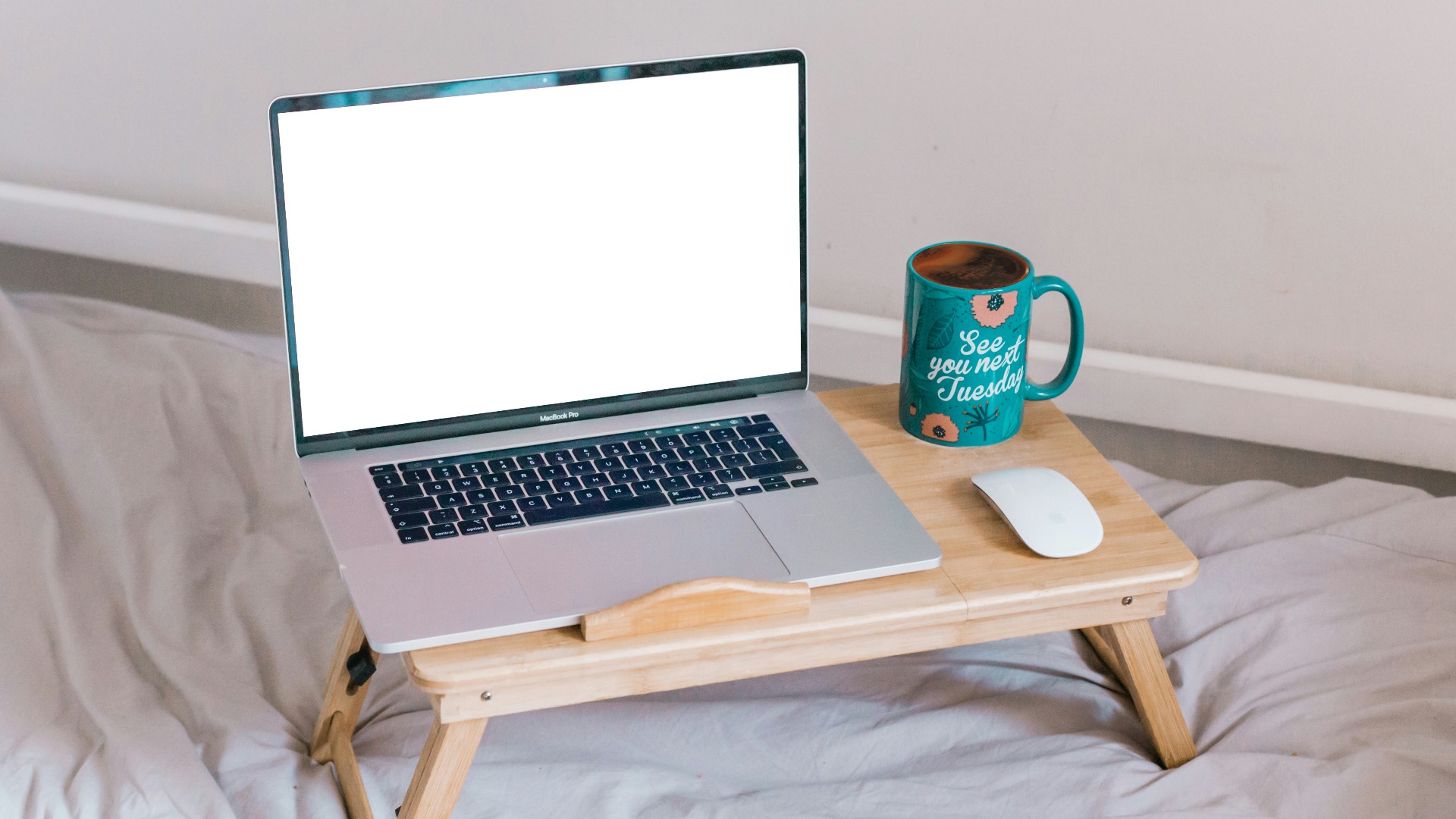 macbook air on brown wooden table