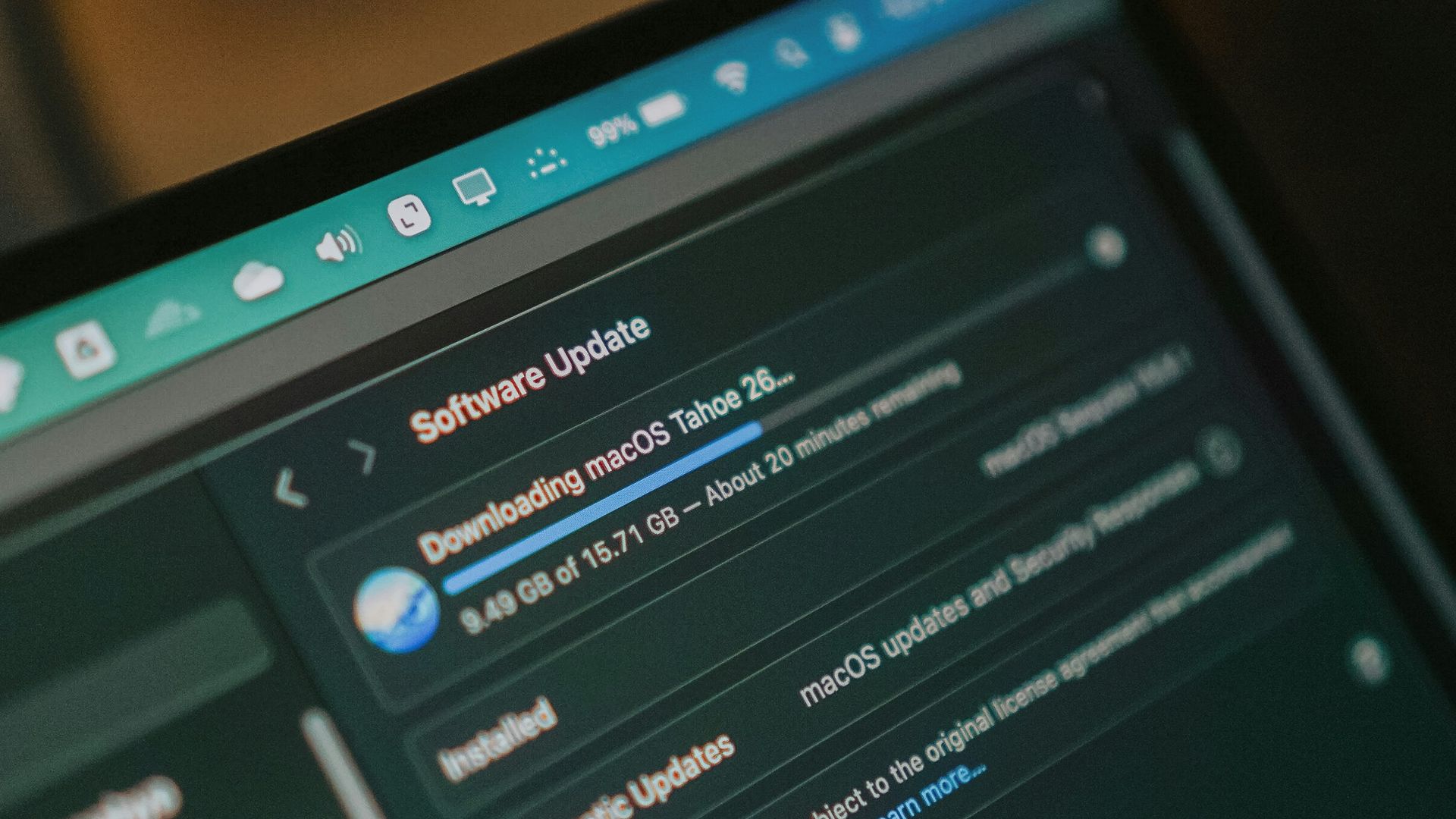 Macbook screen shows macos software update downloading