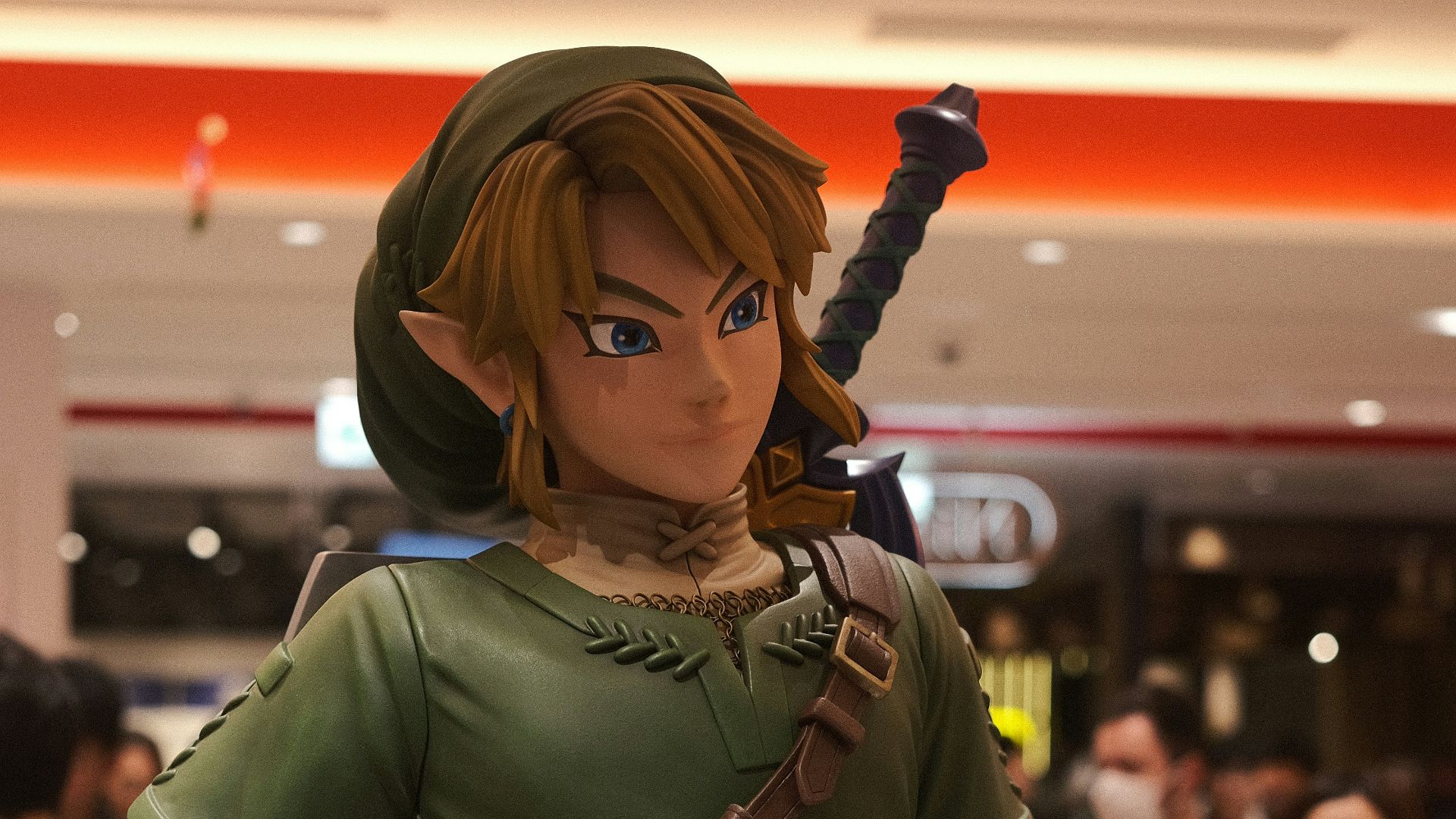 a statue of a woman in a green outfit