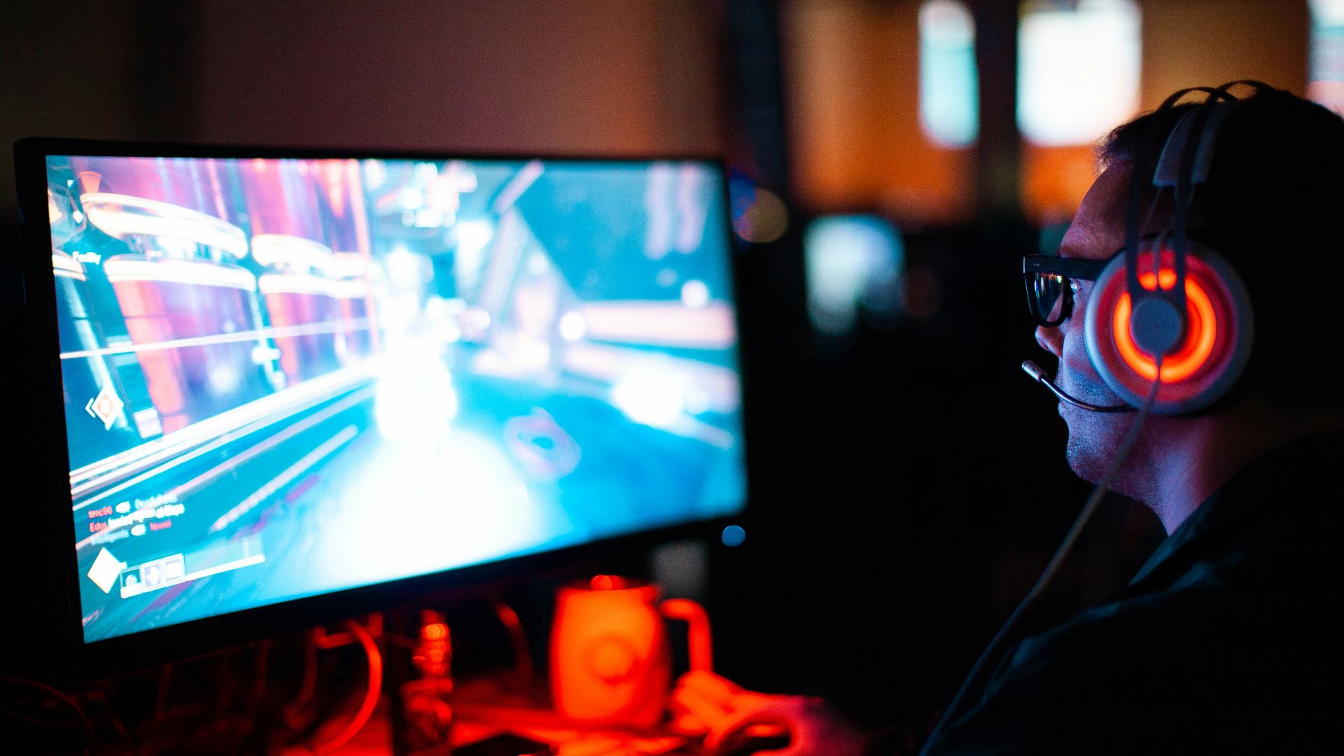 person using computer playing FPS game