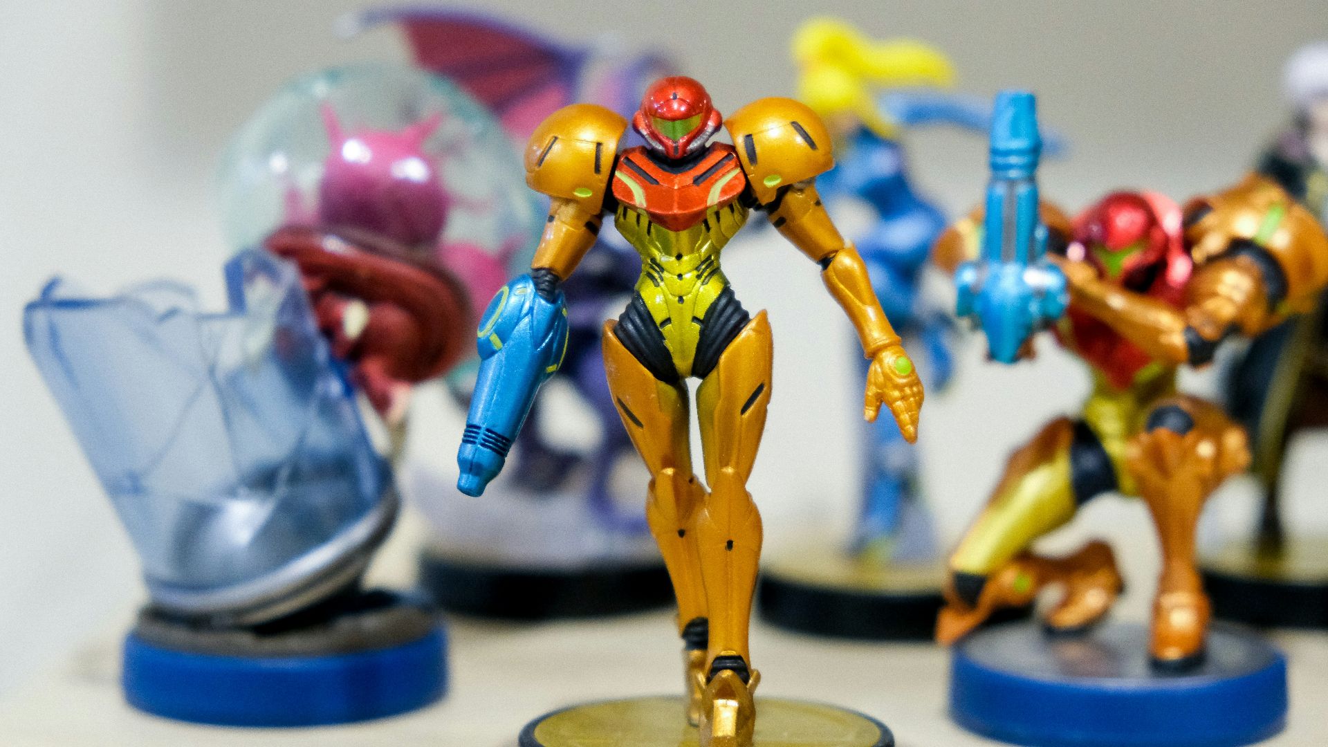 man wearing yellow and red costume character scale model