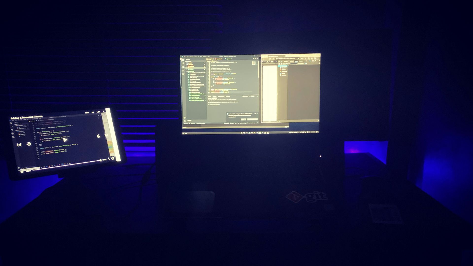 a computer monitor sitting on top of a desk