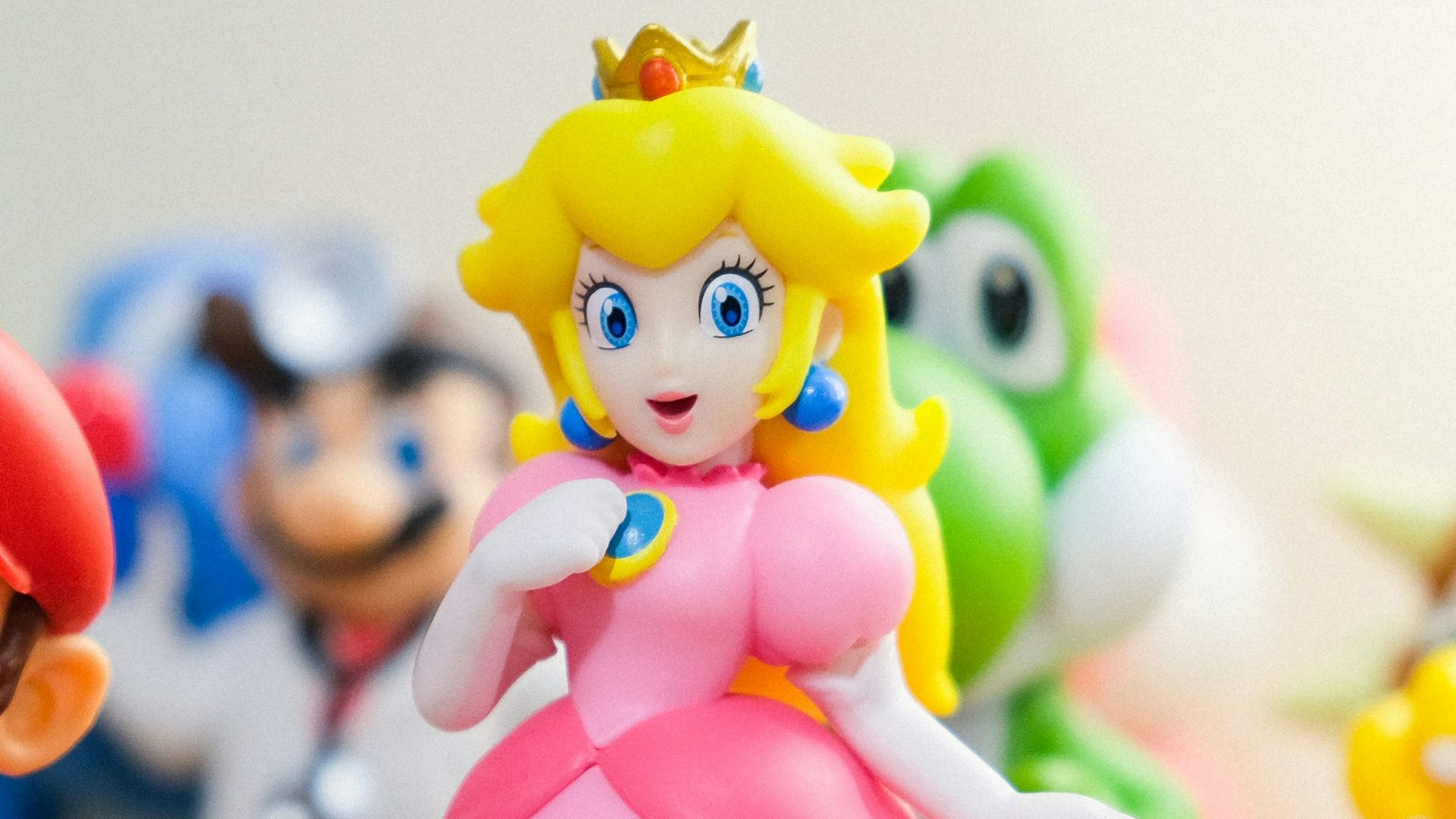Mario, Luigi, and Princess Peach figurines