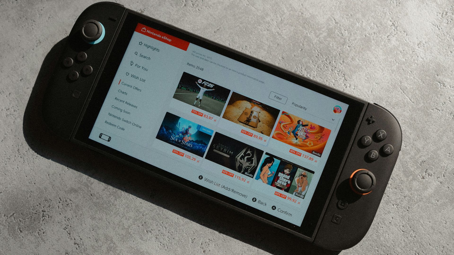 Handheld gaming console displaying a video streaming service.