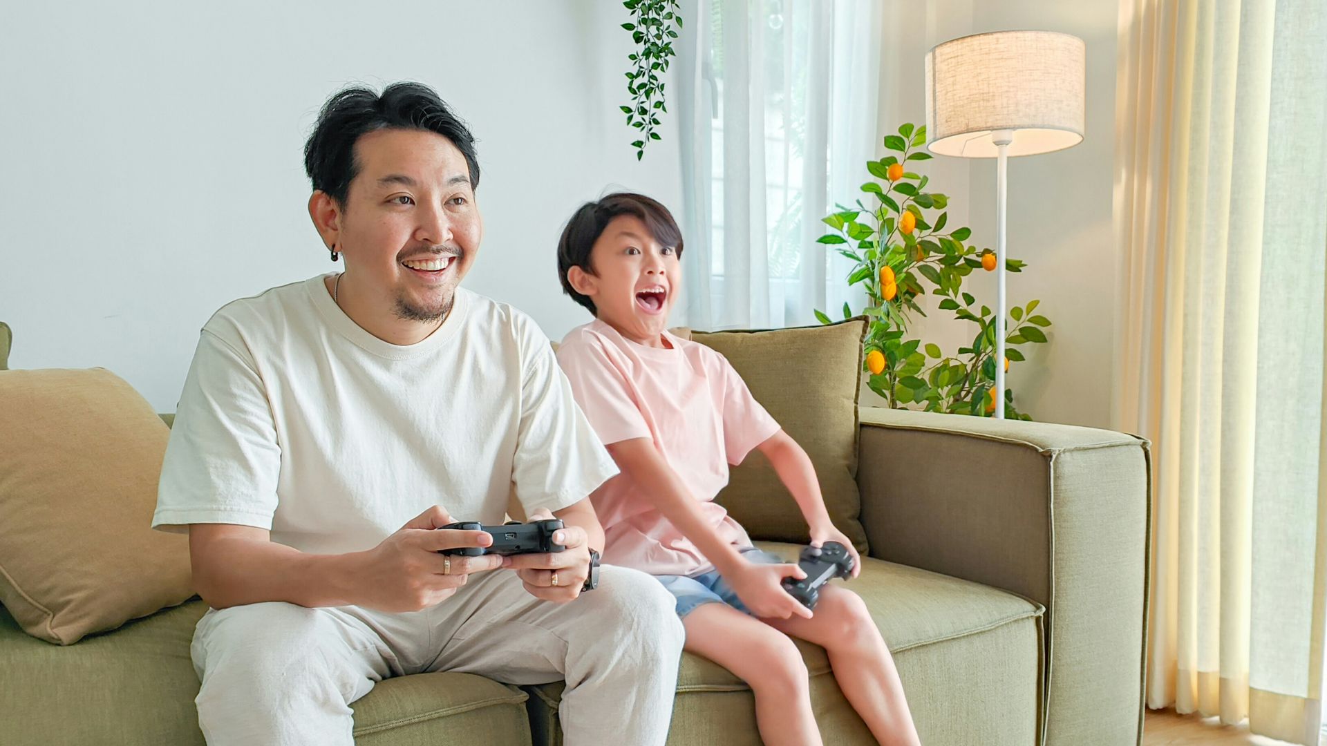 a person and a child sitting on a couch