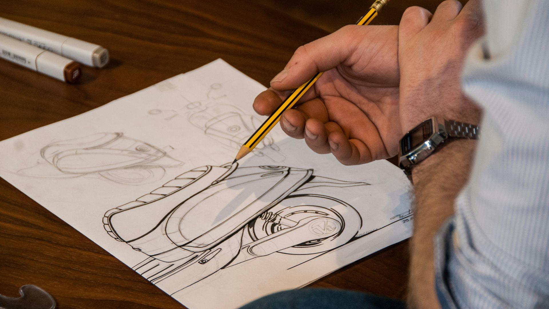 person drawing on white paper