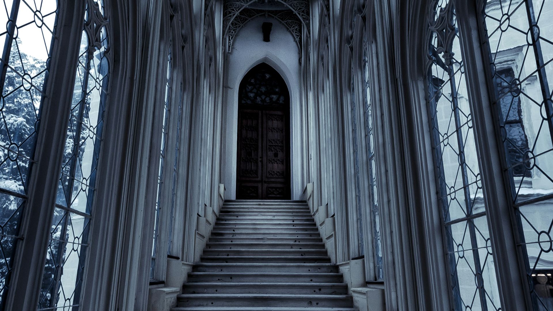 a set of stairs leading up to a large window