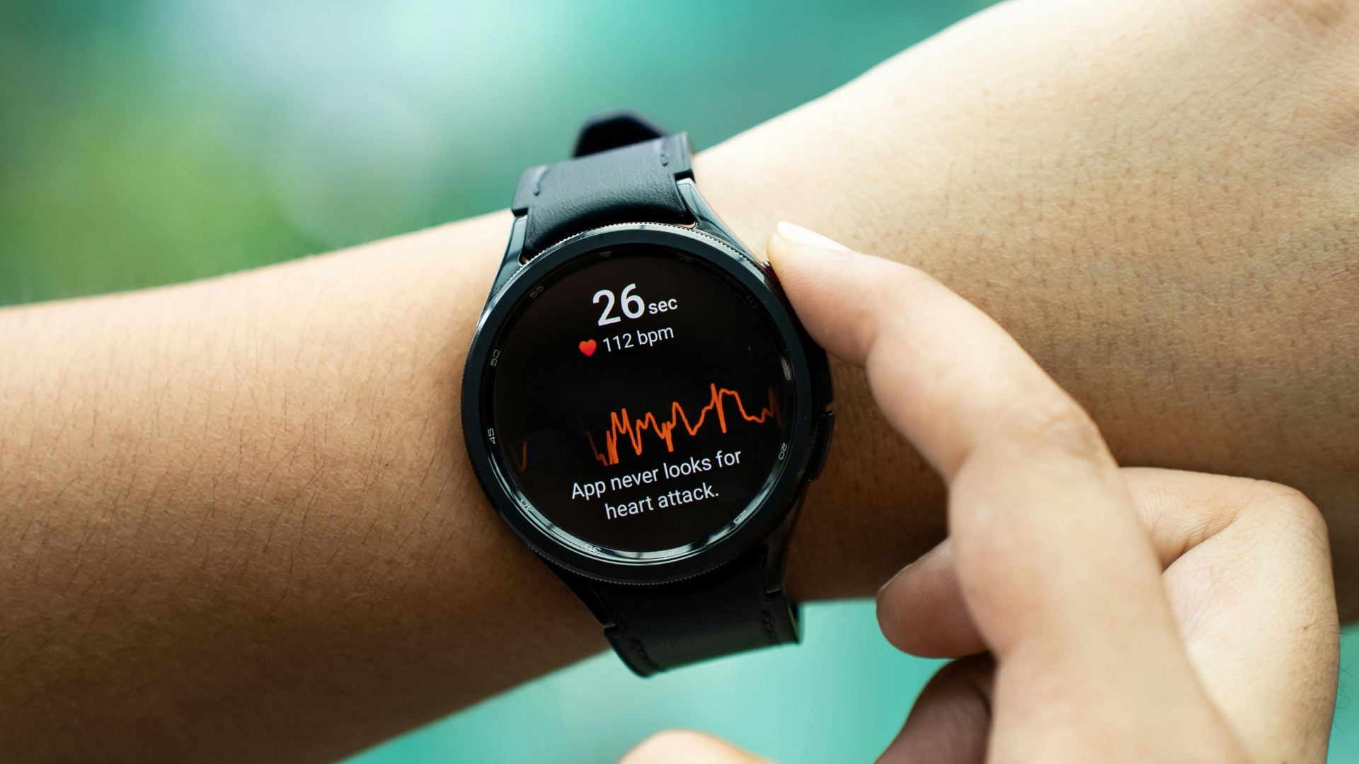 a close up of a person holding a smart watch