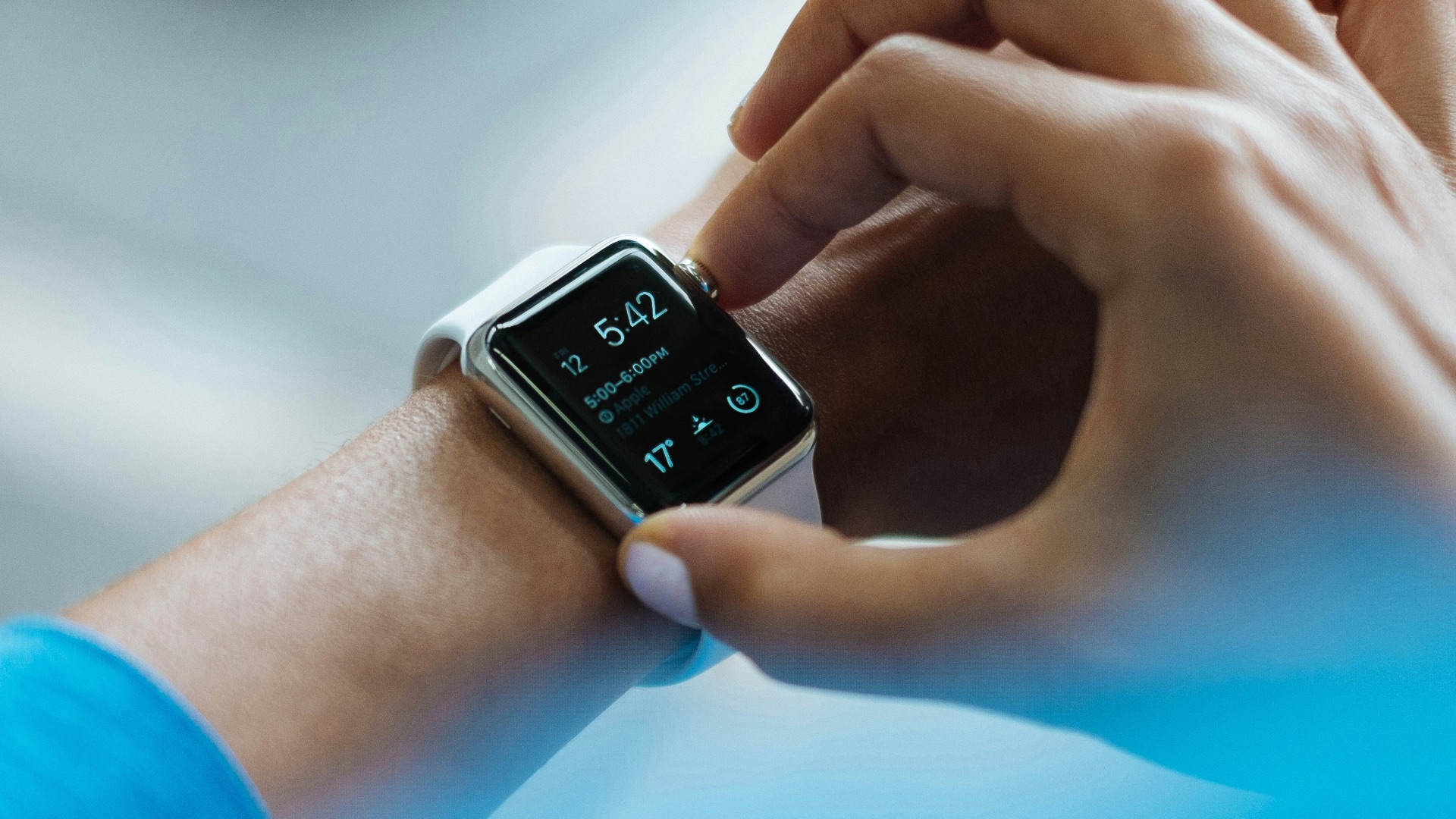 person clicking Apple Watch smartwatch