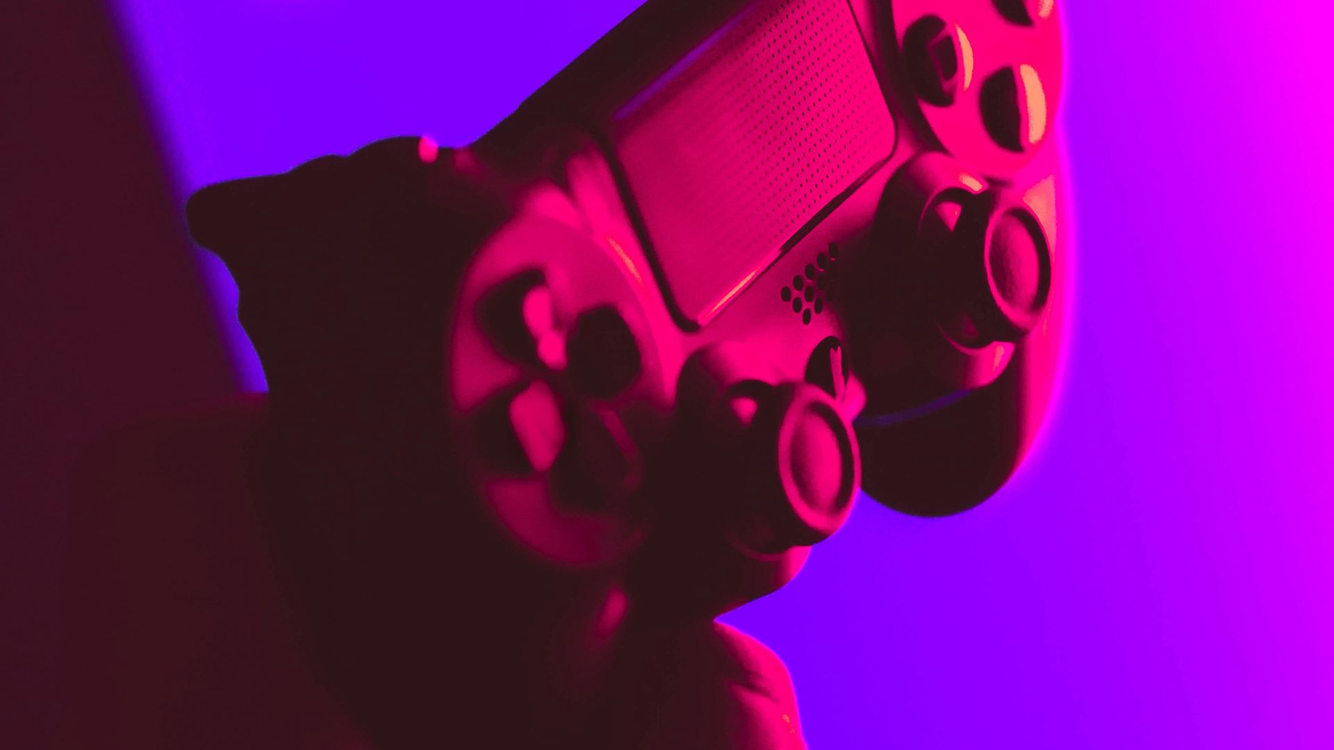 person holding black and gray game controller