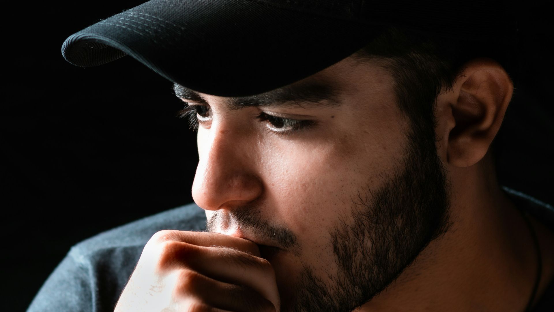 man in black hat and white shirt