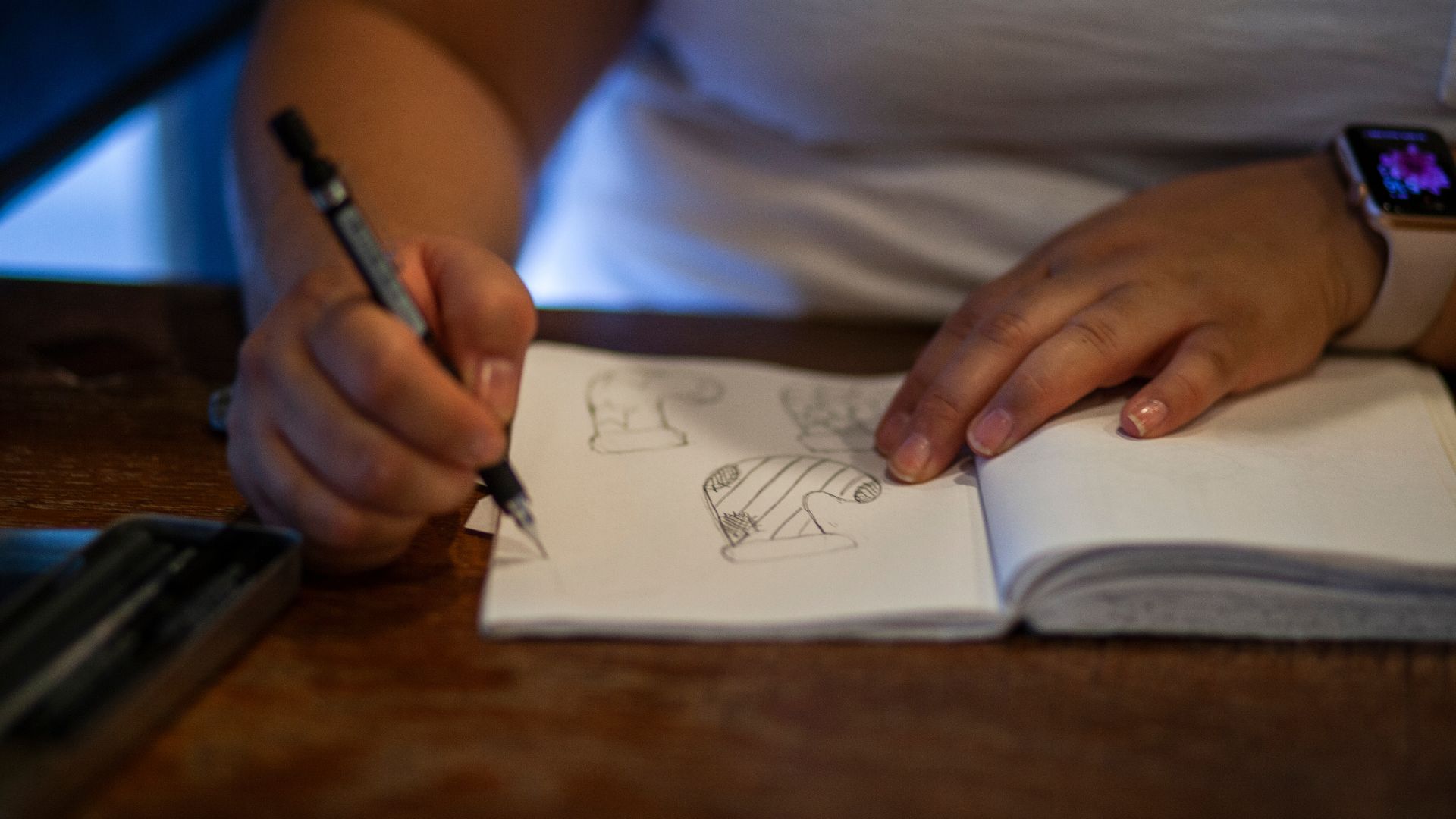 person writing on white paper