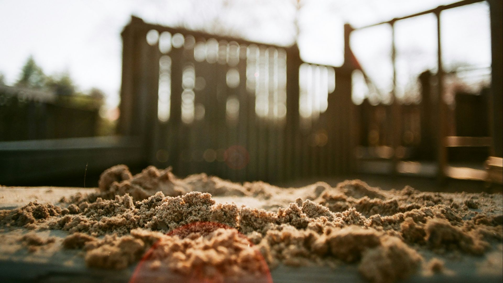 a pile of sand sitting on top of a sidewalk