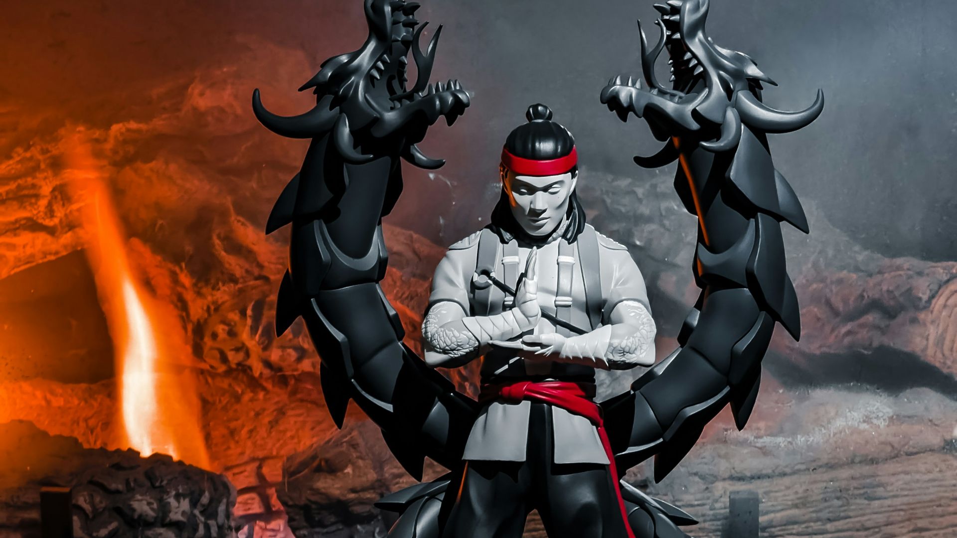 a statue of a man sitting on top of a chair