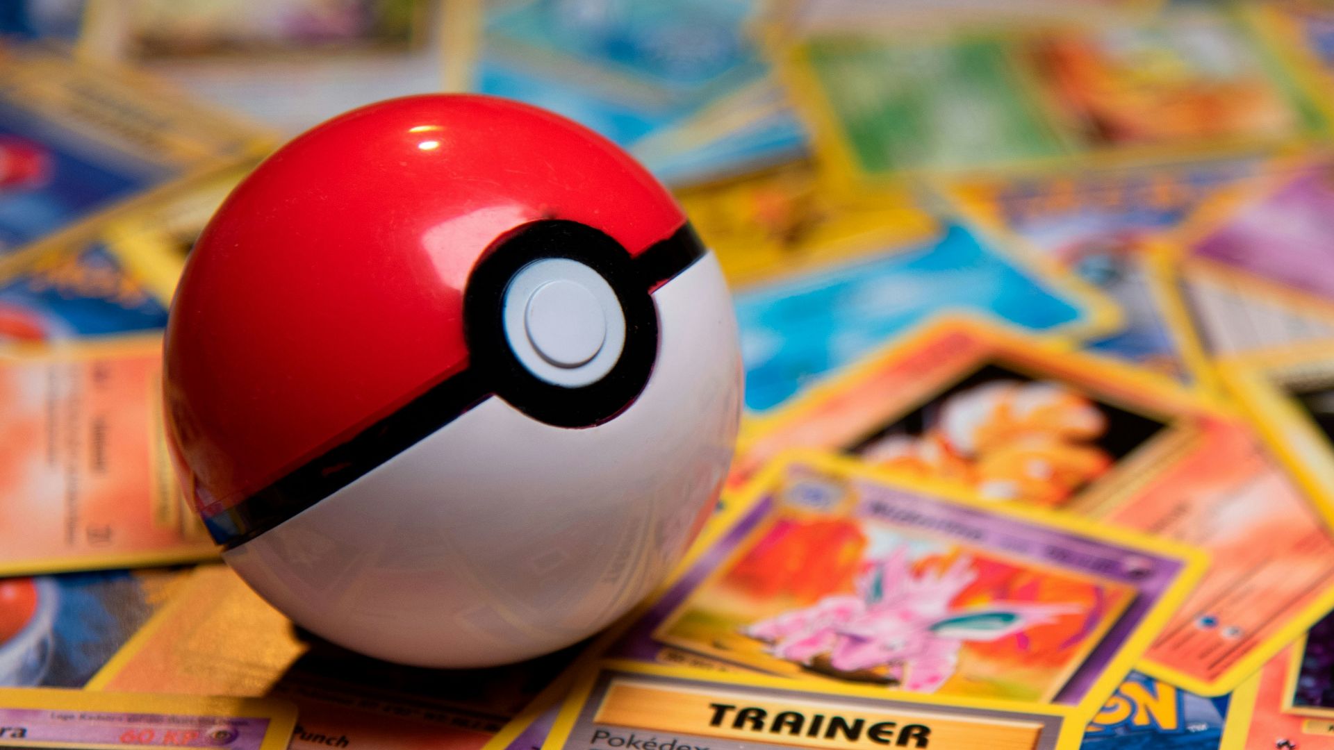 red and white ladybug toy on white and yellow book