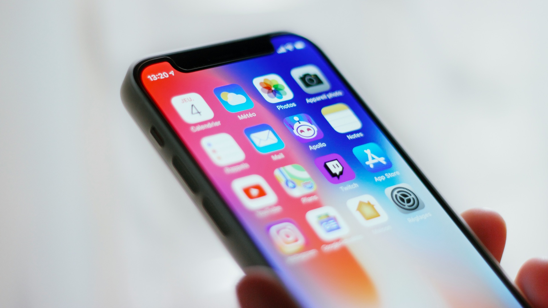 person holding black iphone 4