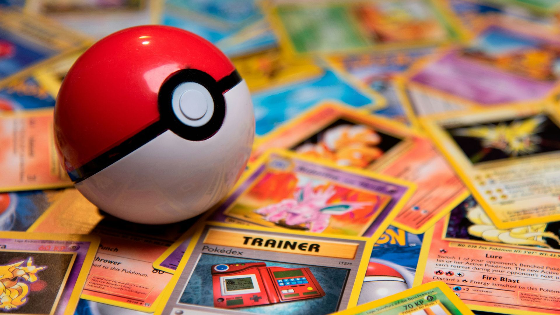 red and white ladybug toy on white and yellow book