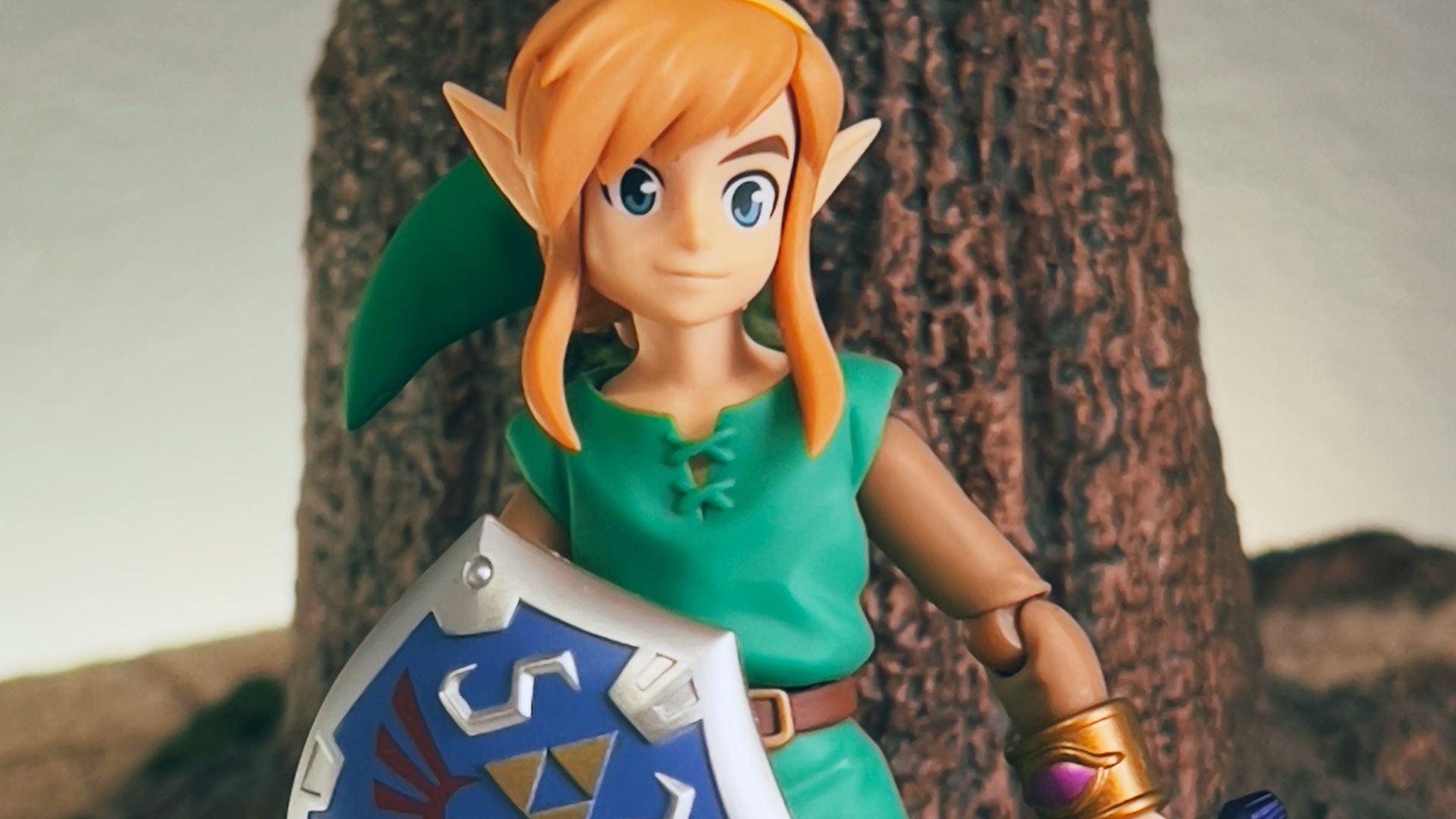 a toy girl holding a sign