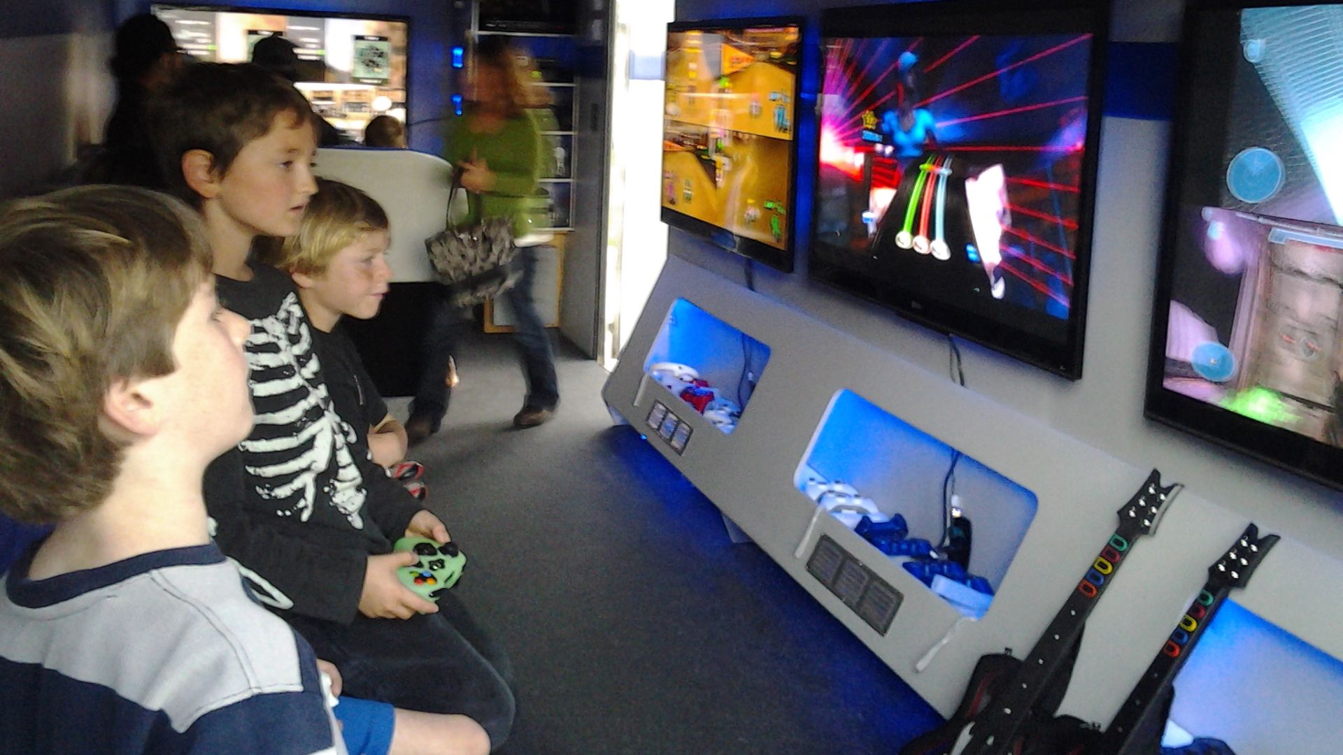 File:Children playing video games & TV's.jpg