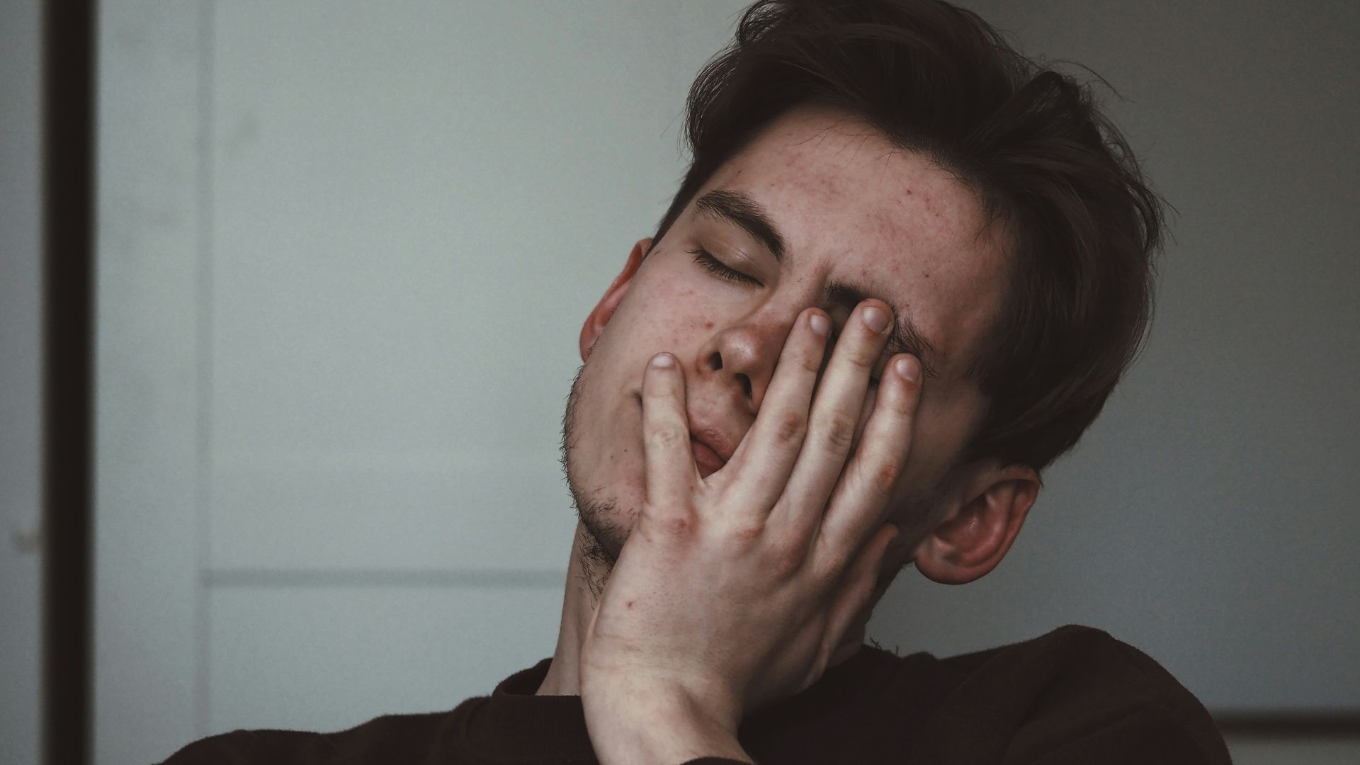 man wearing black crew-neck top