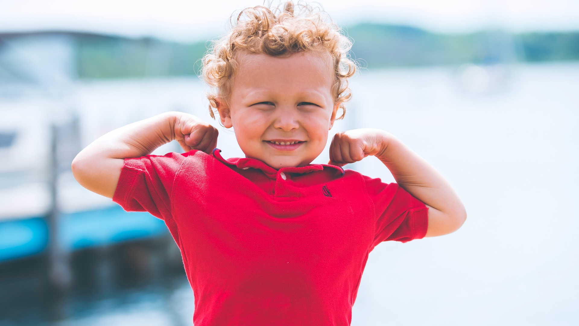 boy standing near dock