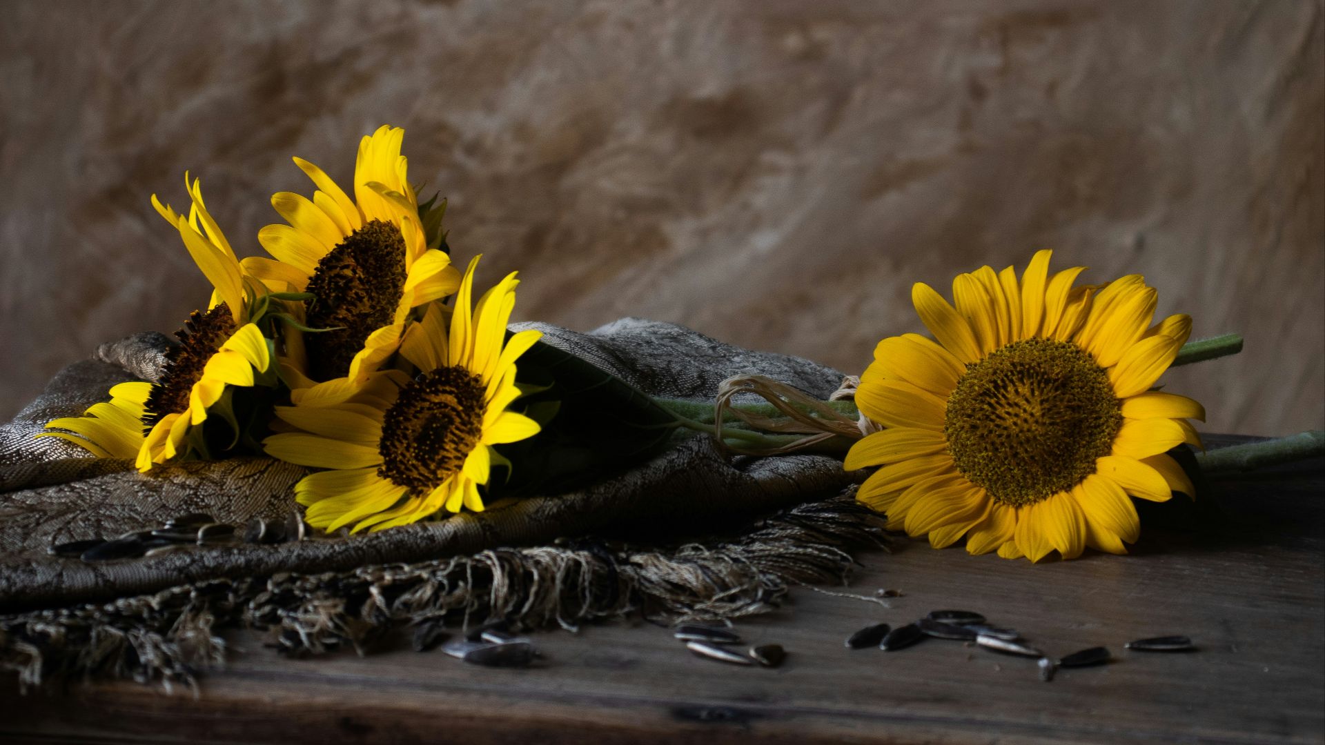 a bunch of sunflowers sitting on top of a table