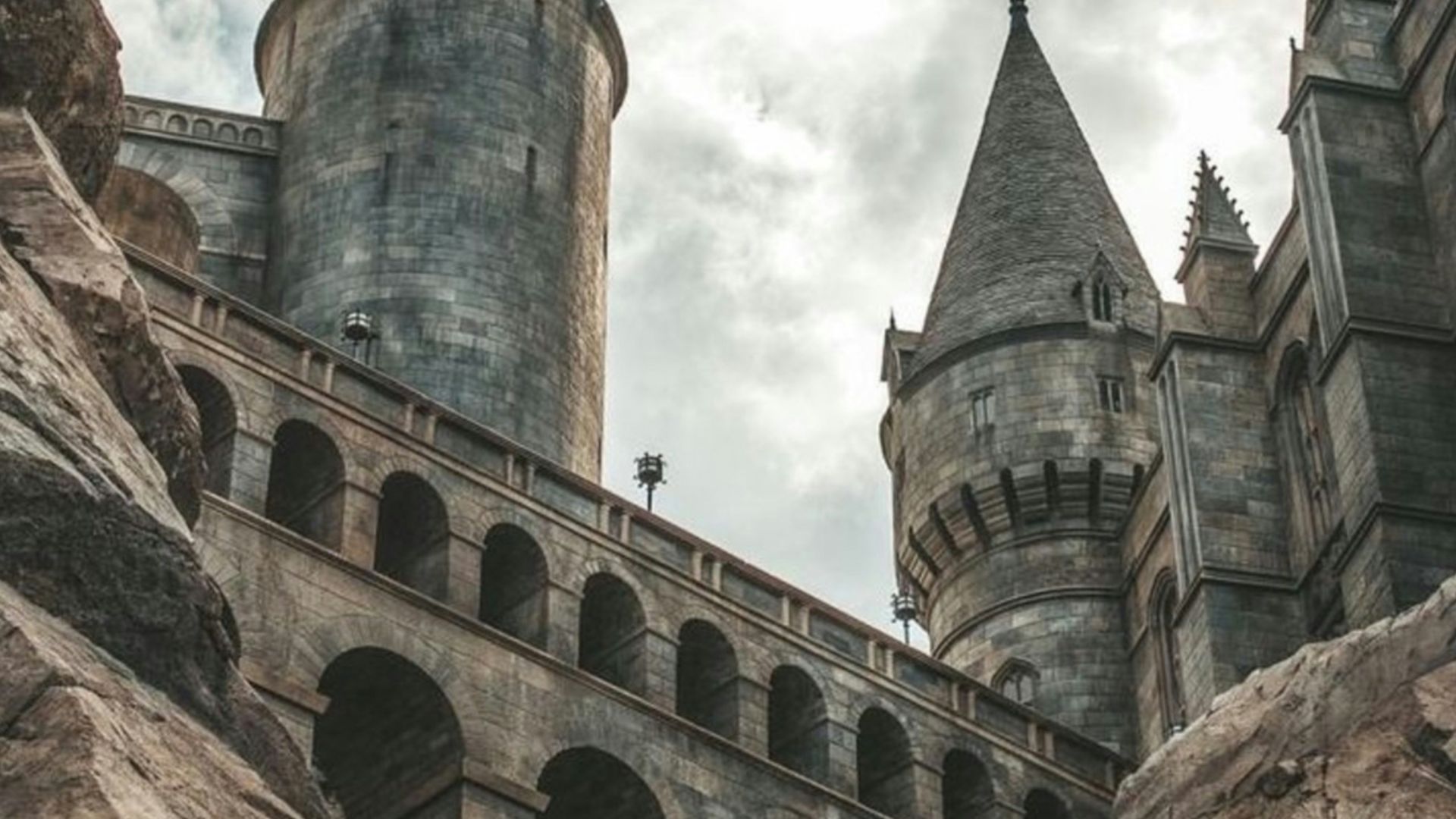 white clouds hovering above grey castle