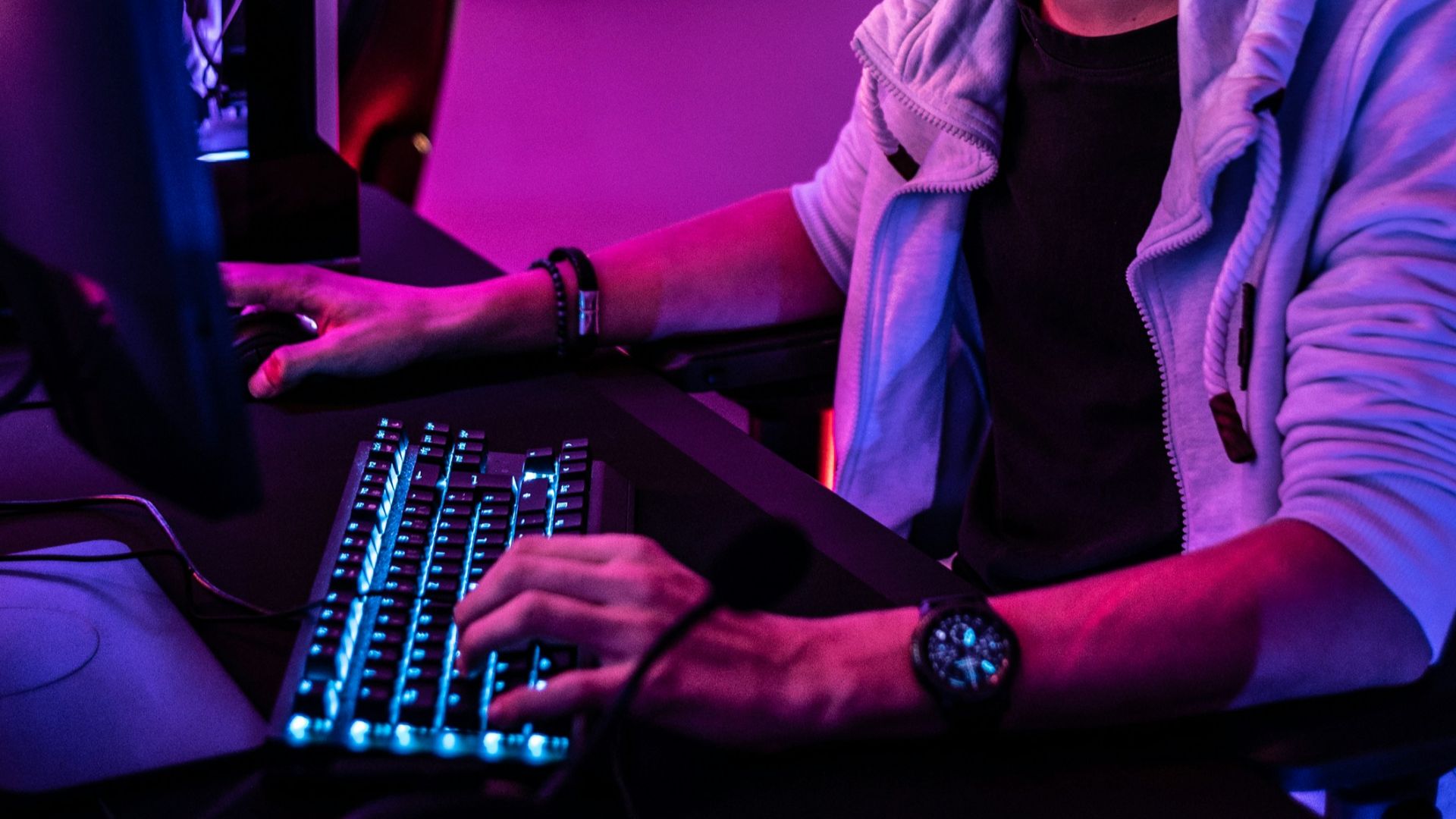 a man sitting in front of a computer keyboard