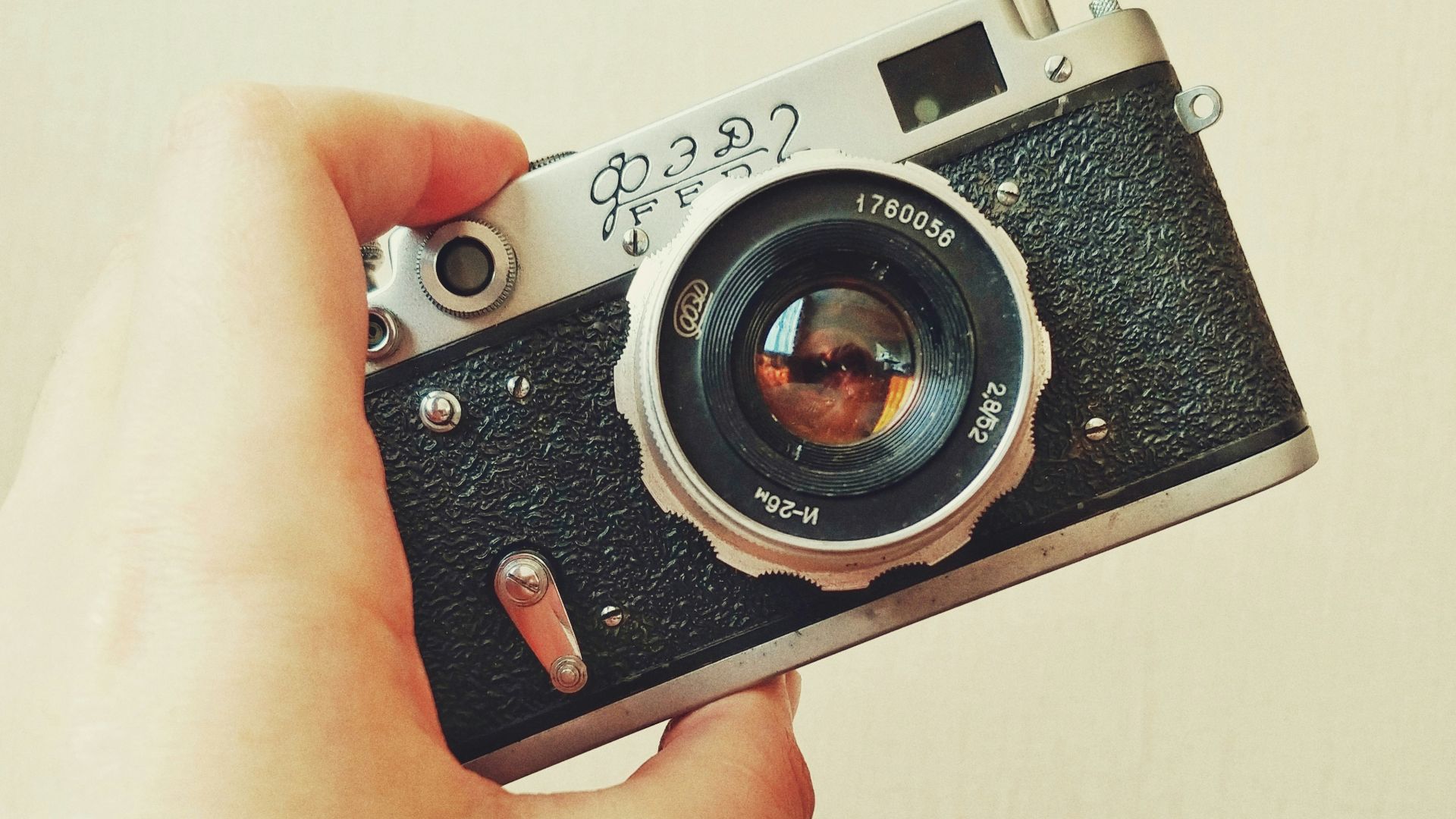 silver and black point and shoot camera