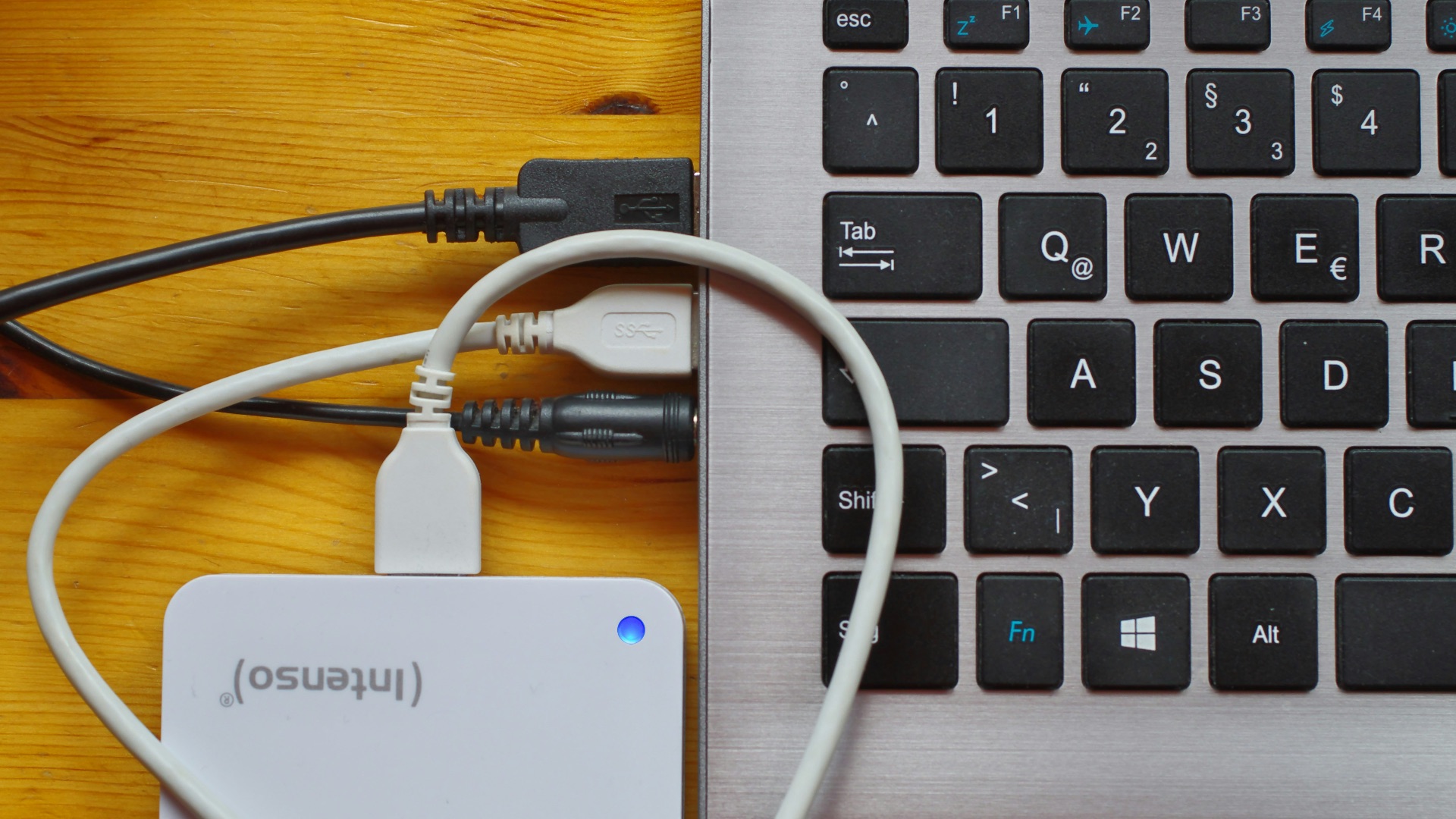 white usb cable on gray laptop computer