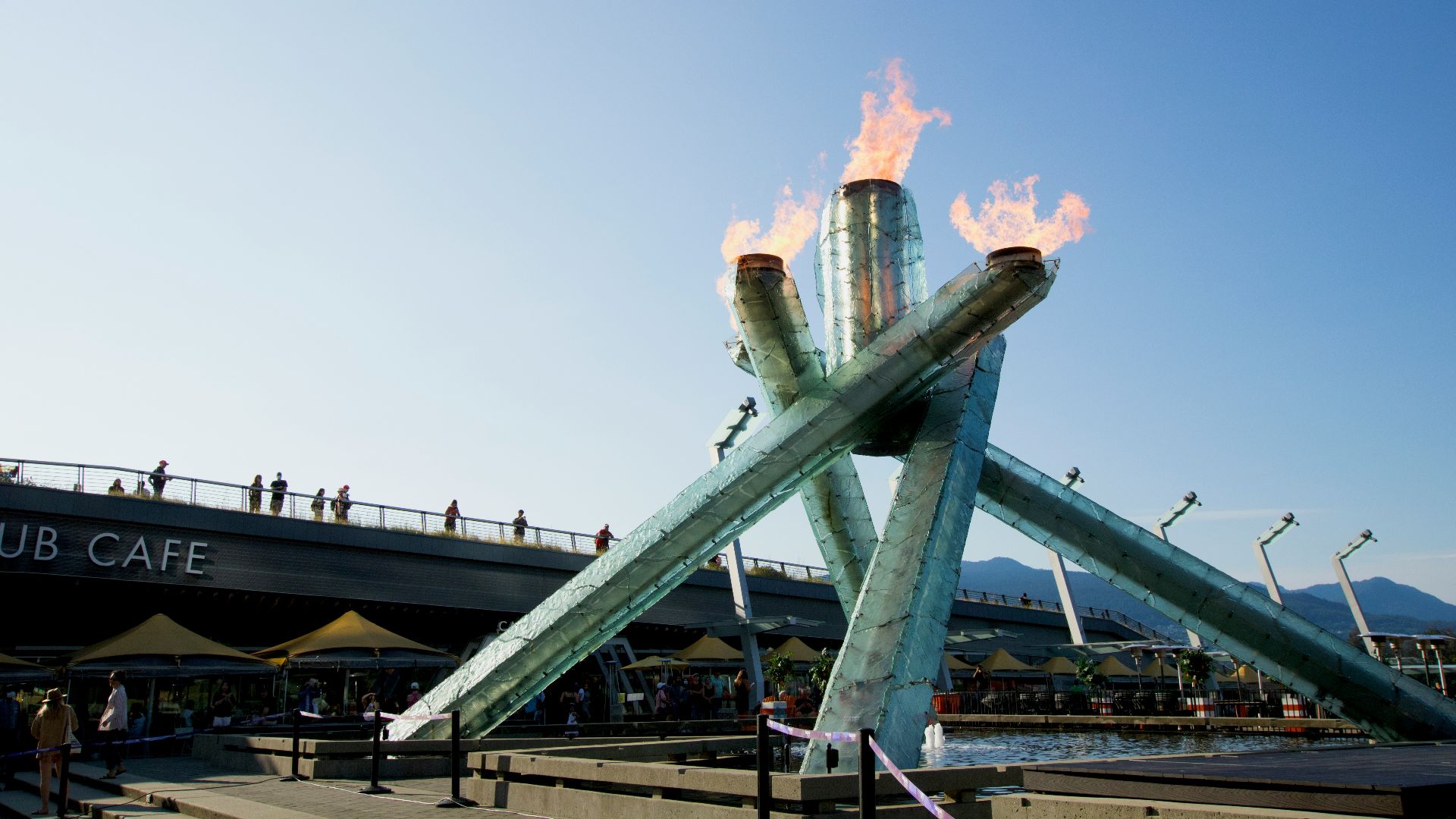 a large metal structure with flames on top of it