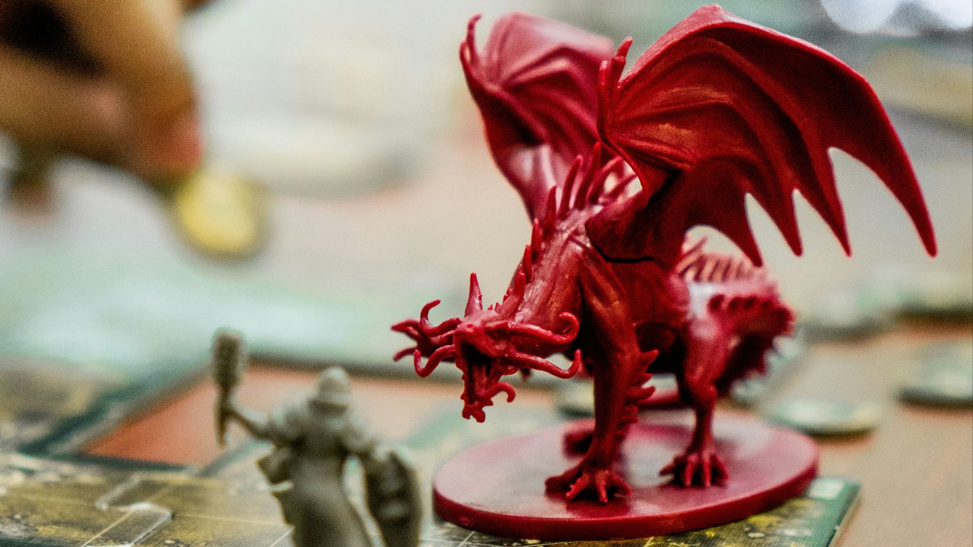 red dragon action figure on table