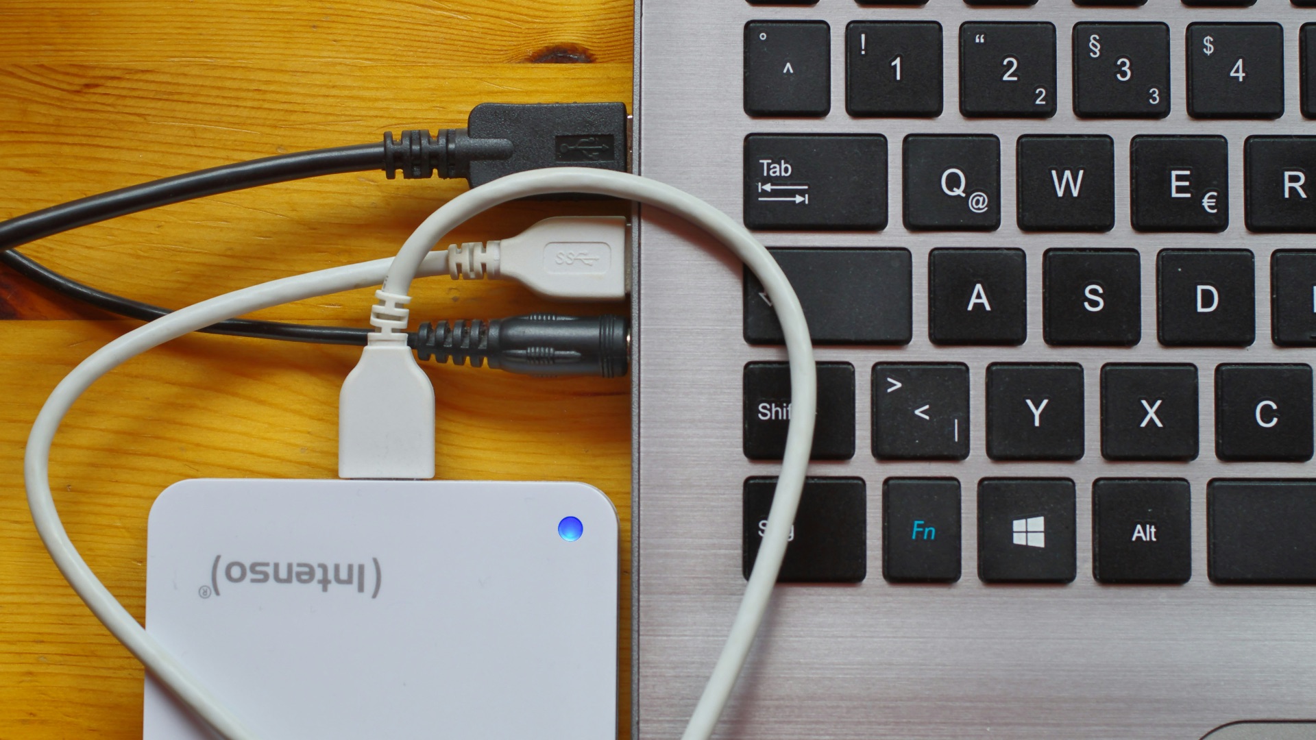white usb cable on gray laptop computer