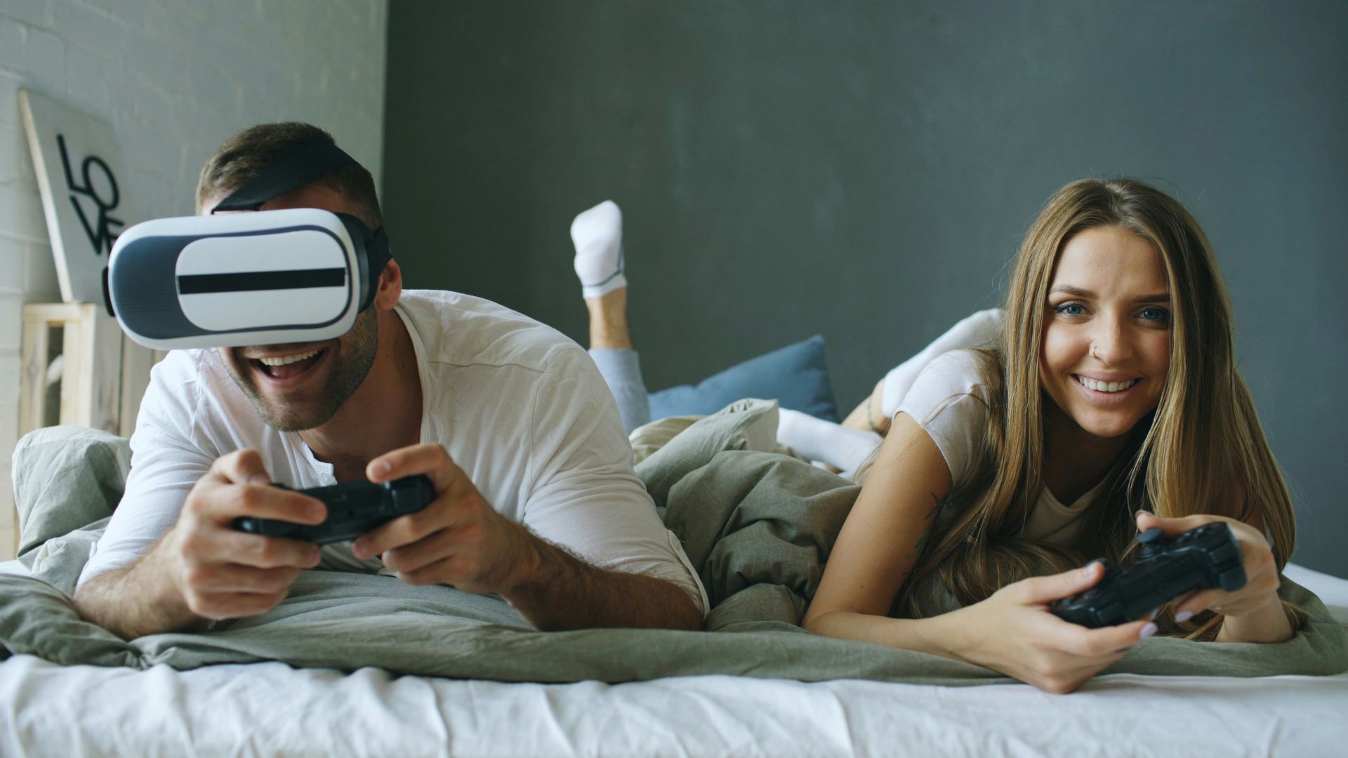 Couple playing video games with vr headset