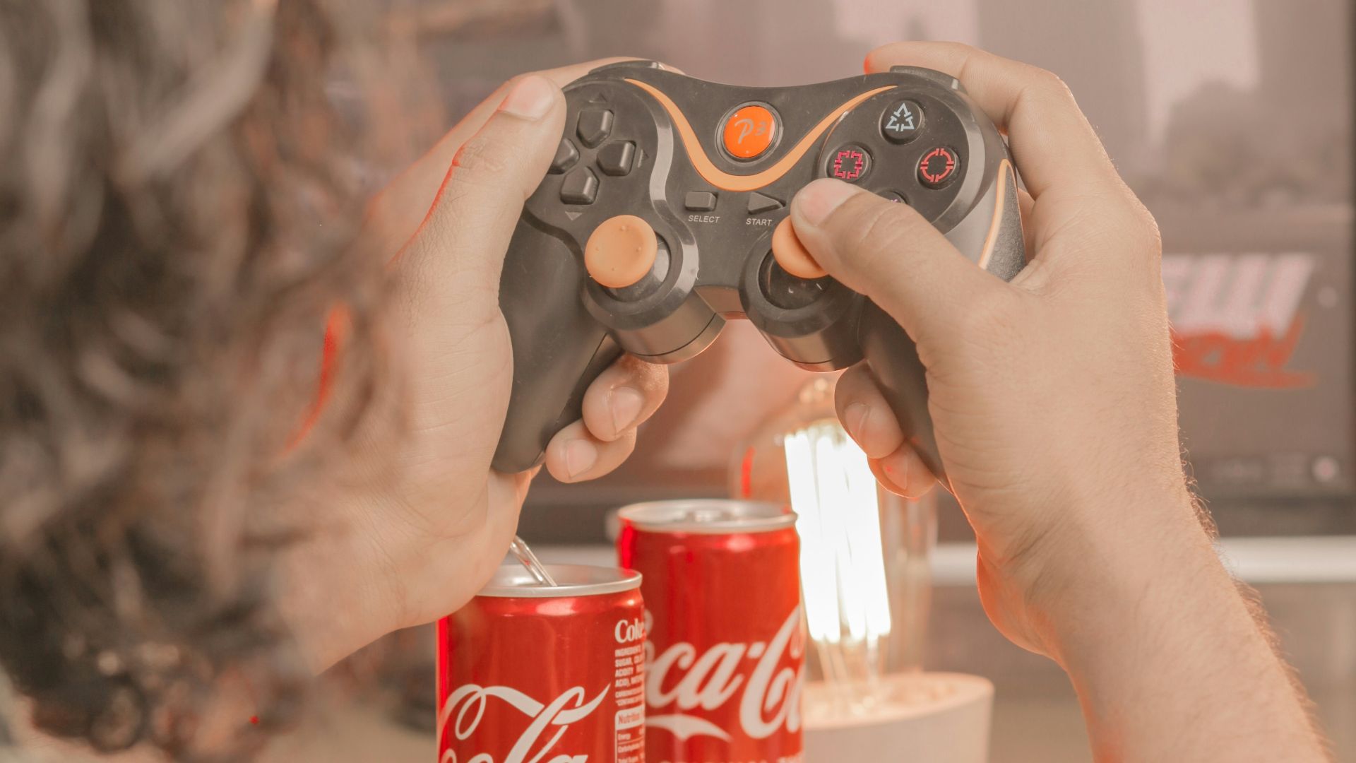 a person holding a remote control in their hand