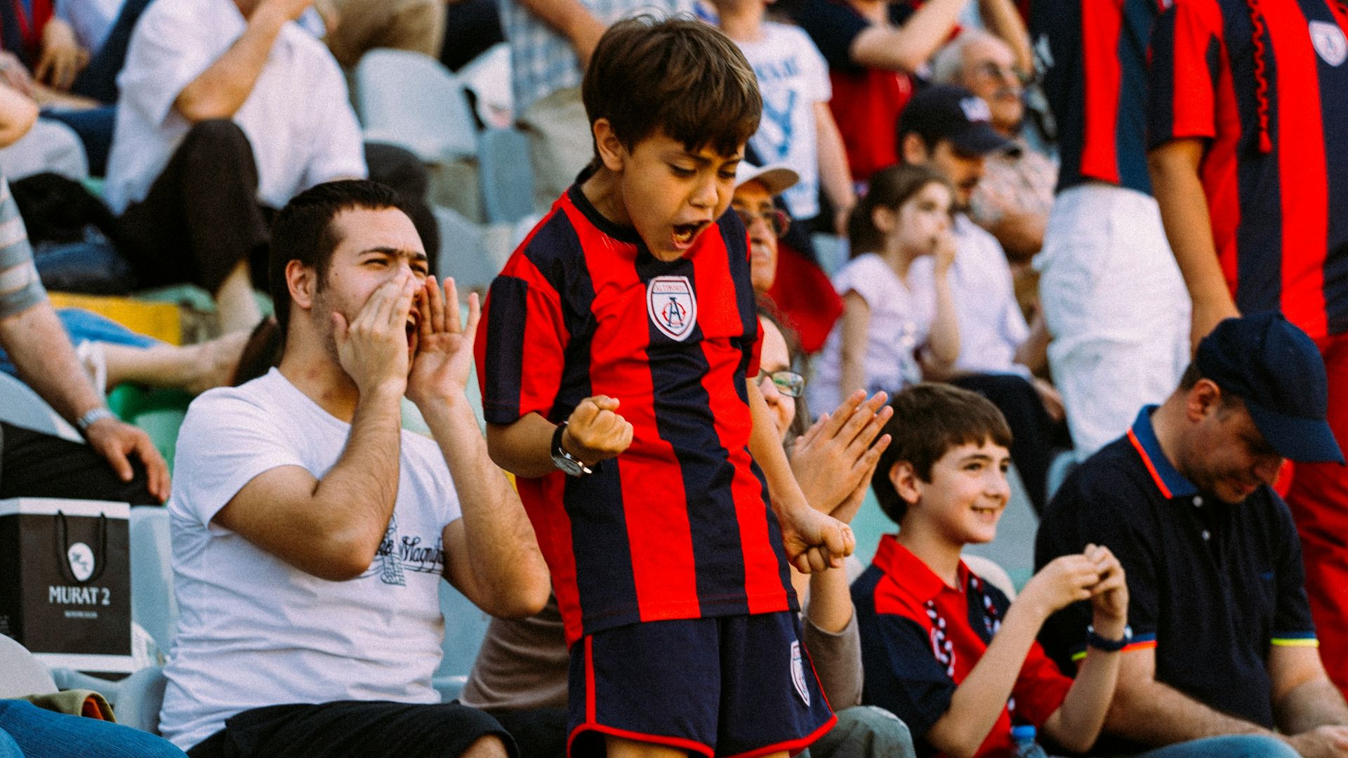 woman in red and black dress sitting on white chair