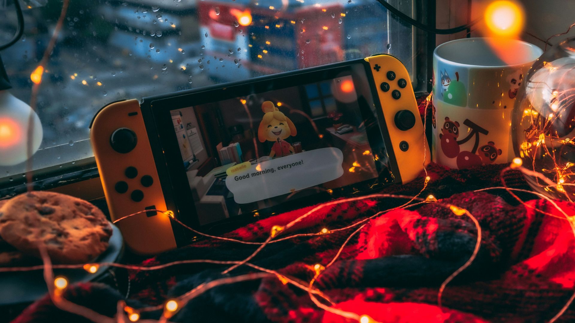 a video game console and a mug