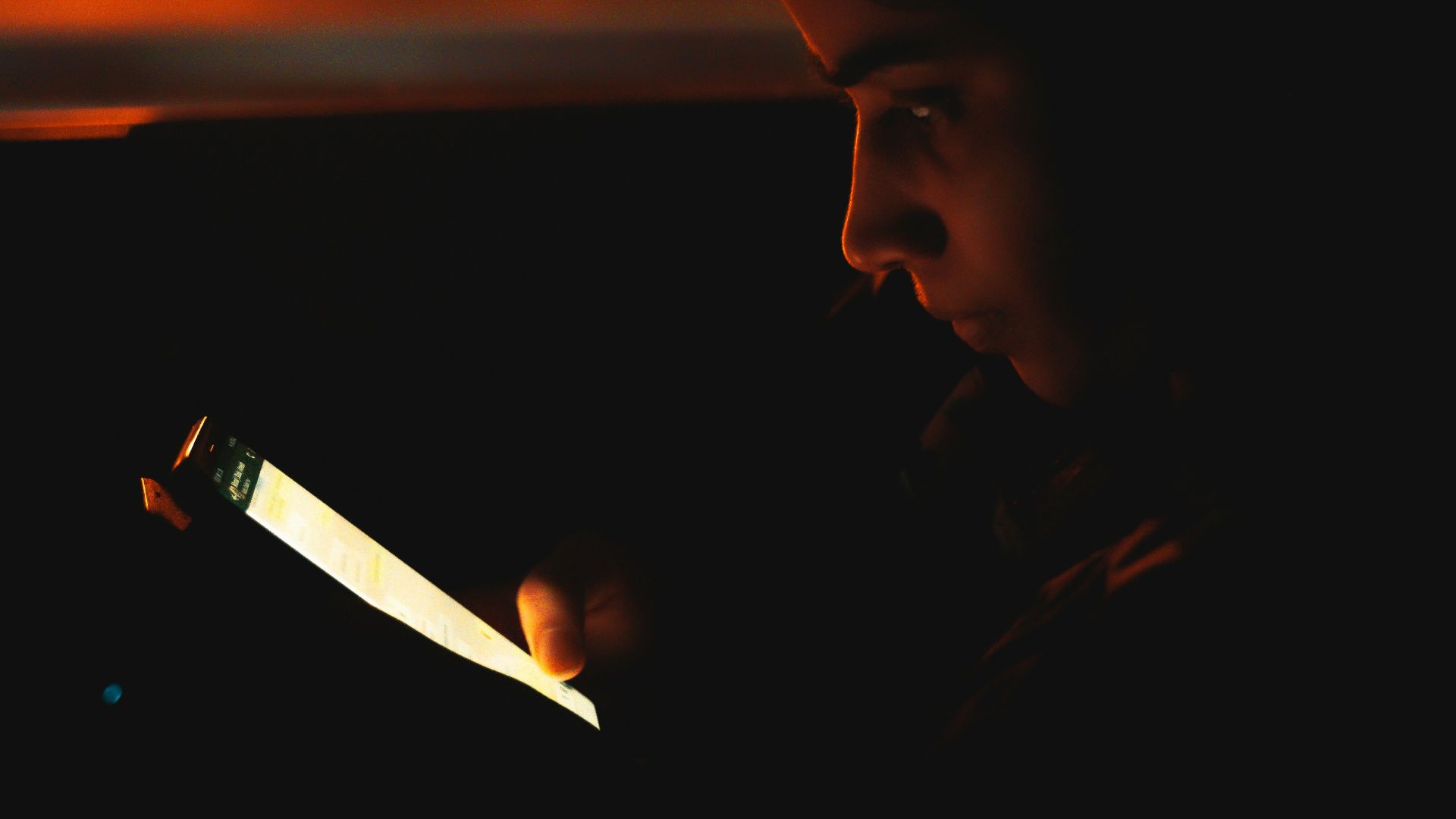 man holding lighted cigarette stick