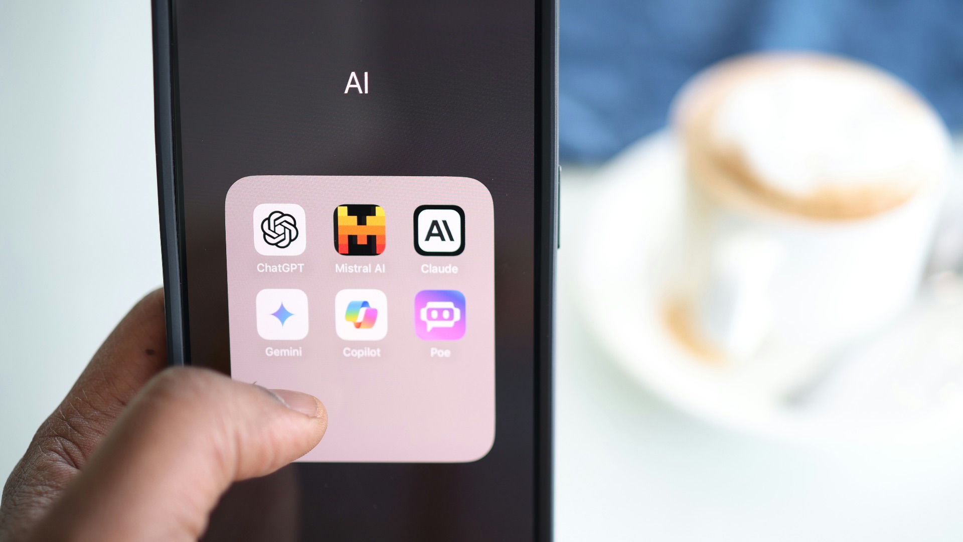 a person holding a cell phone in their hand